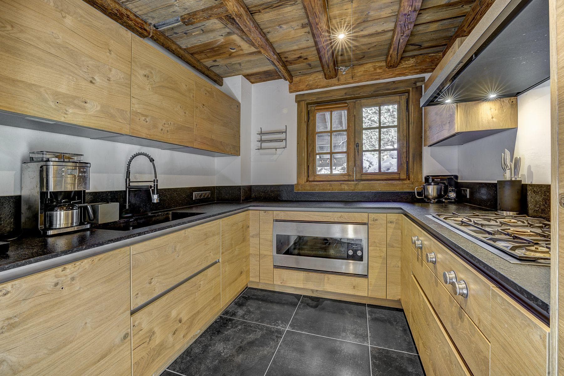 U-shaped chalet kitchen with integrated appliances