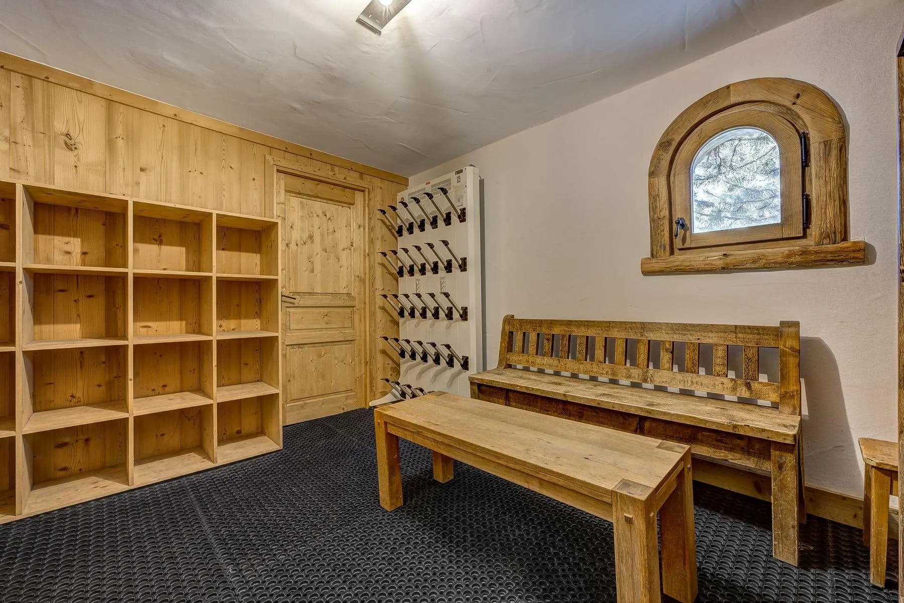 Boot room with heated boot racks, storage and bench seating