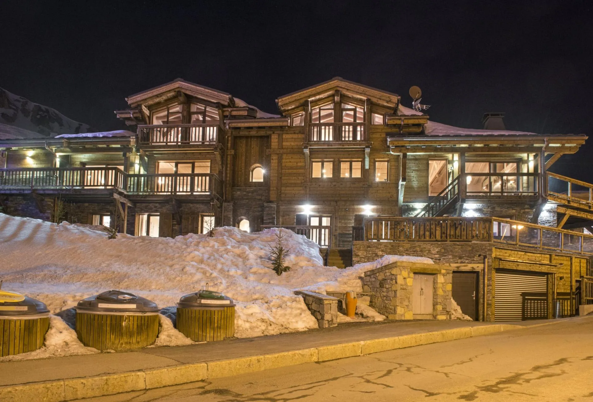 Chalet exterior with multiple balconies and heated driveway access