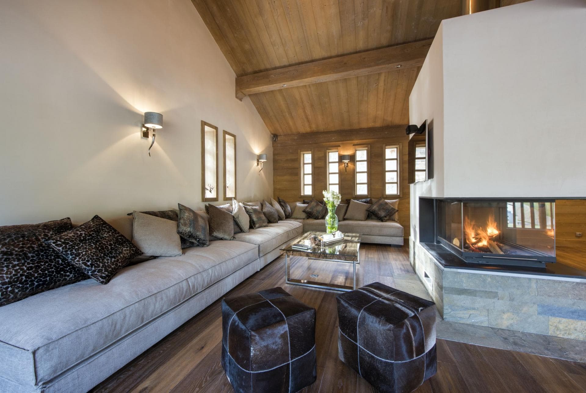 Living area with wood-burning fireplace and sectional seating for 10