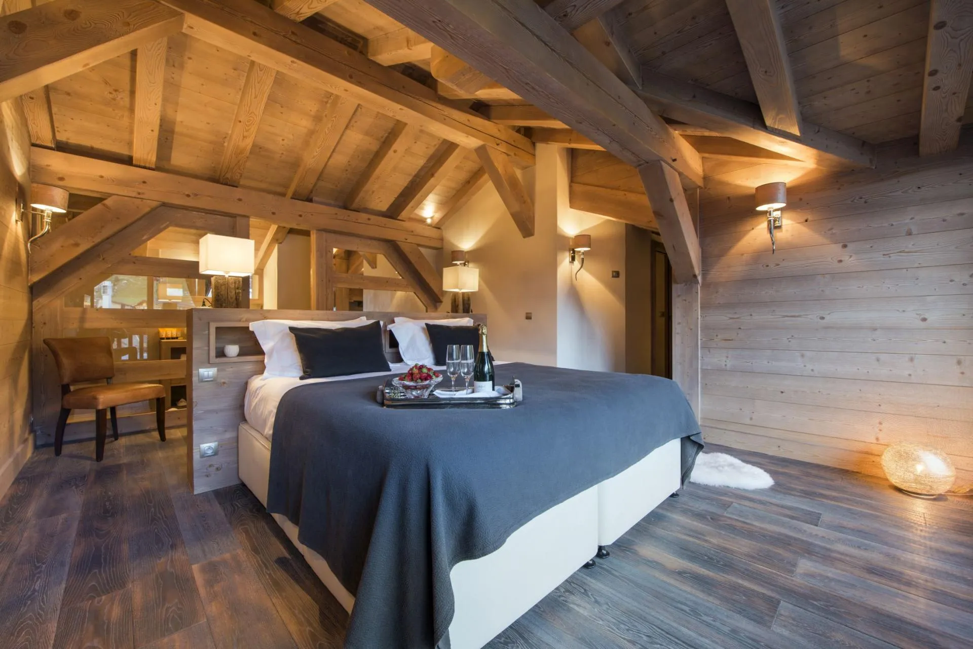 Attic bedroom with king bed and exposed timber beams
