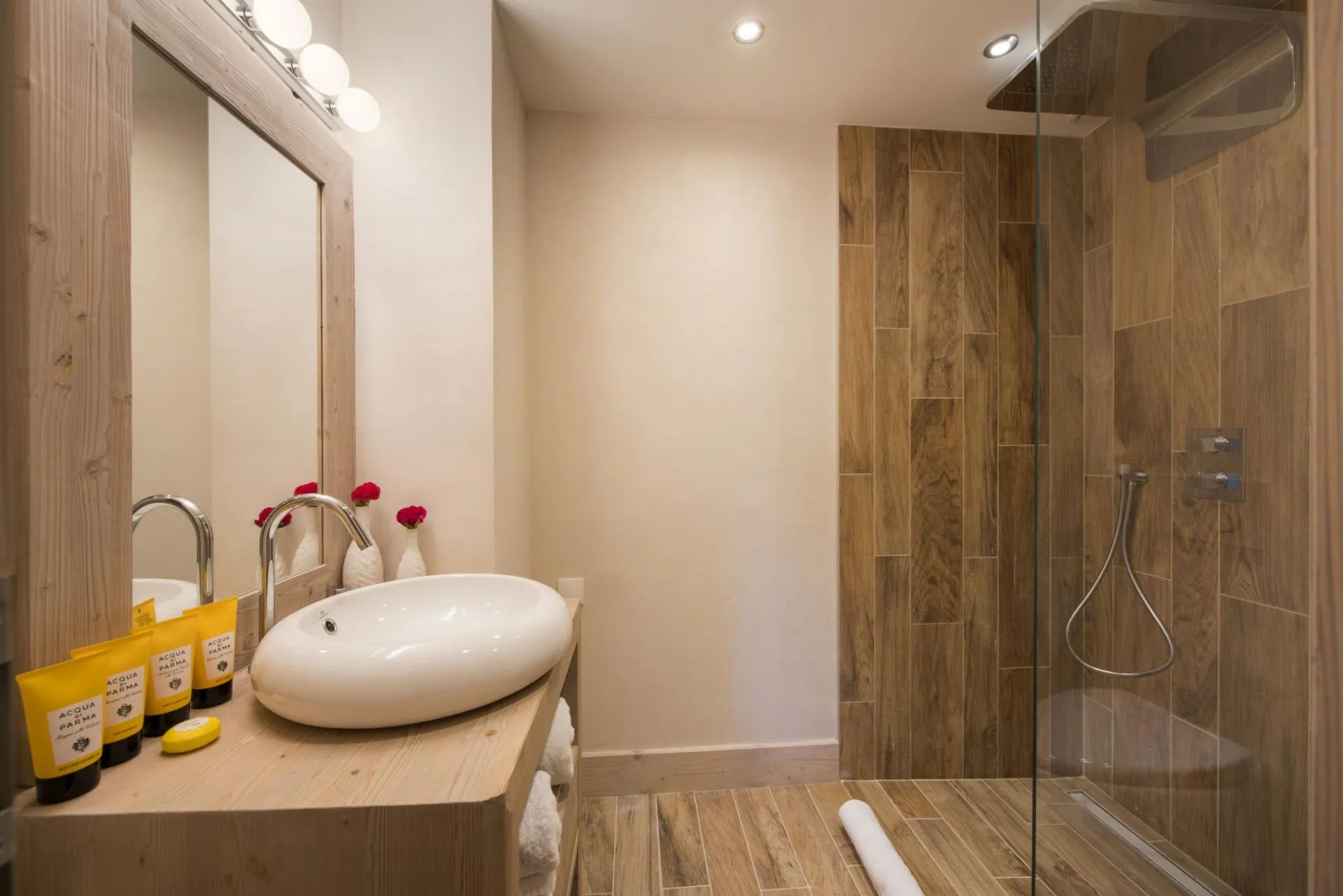 Bathroom with vessel sink and walk-in rain shower