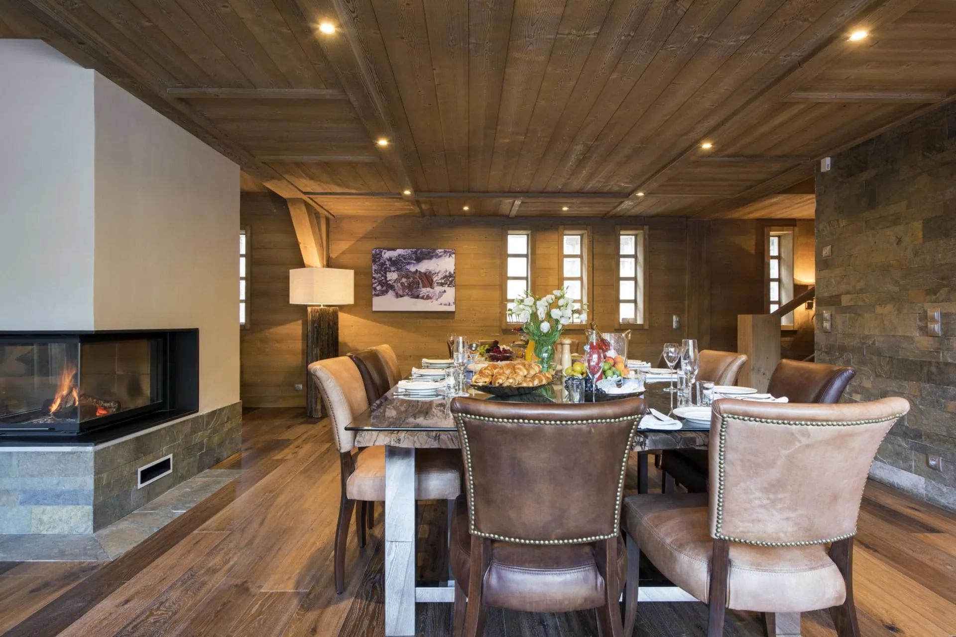Dining area seating 10 with dual-sided glass fireplace