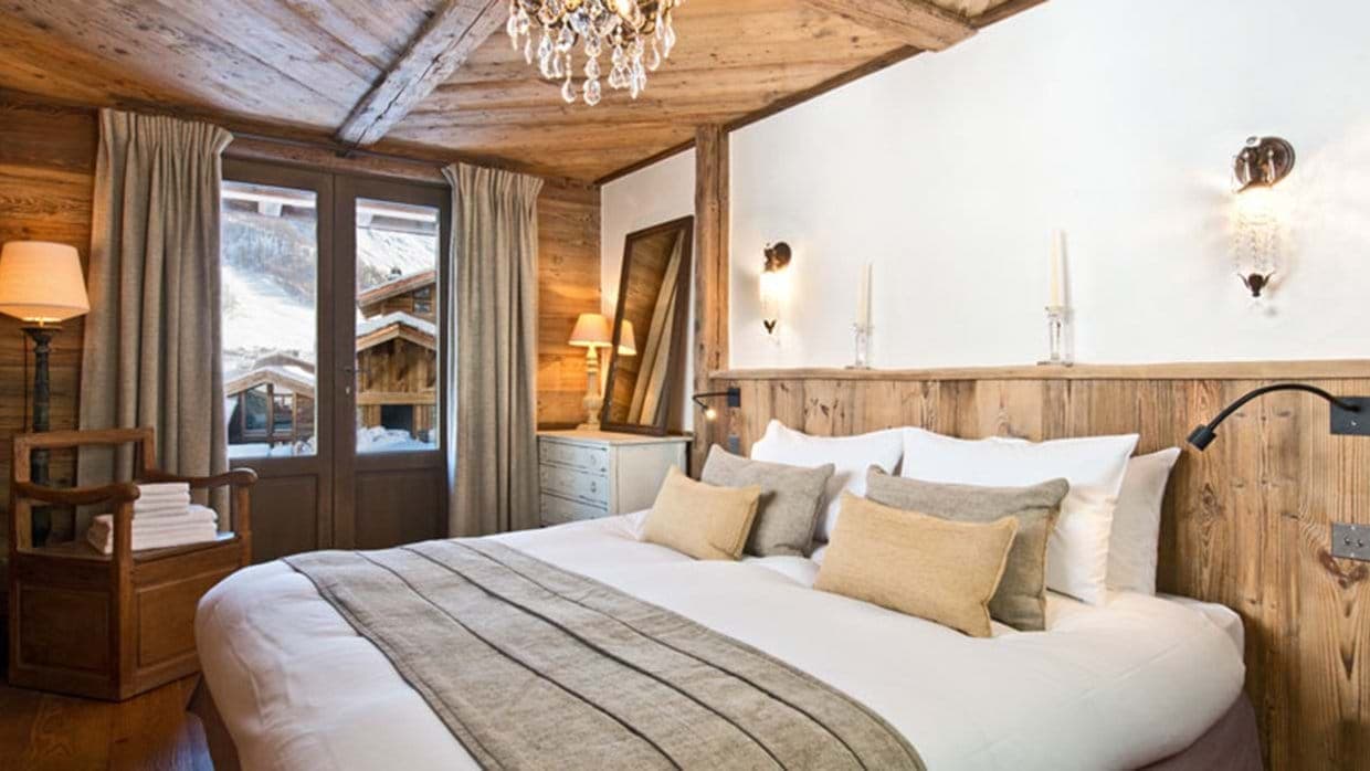 Bedroom with king bed and private balcony access to ski slopes