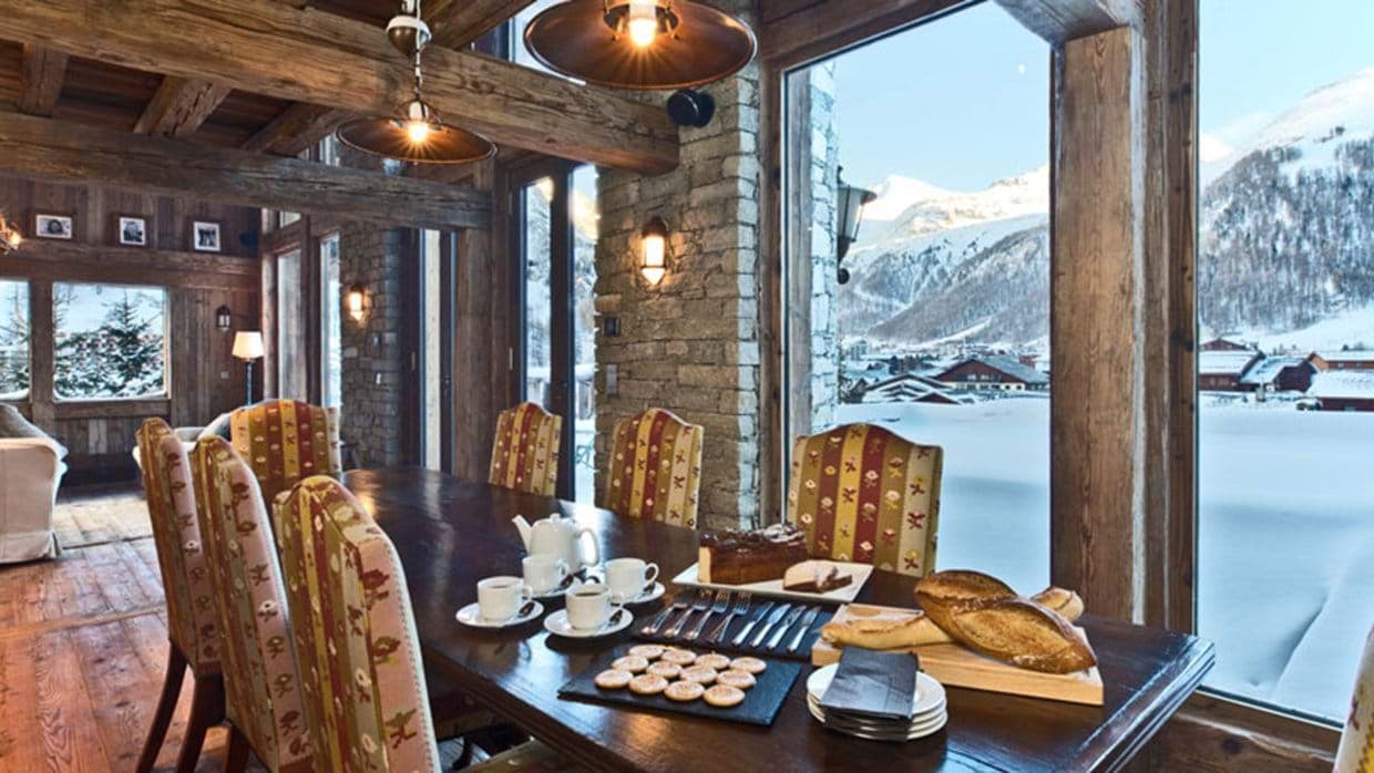 Dining area seating 8 with mountain views and original timber beams