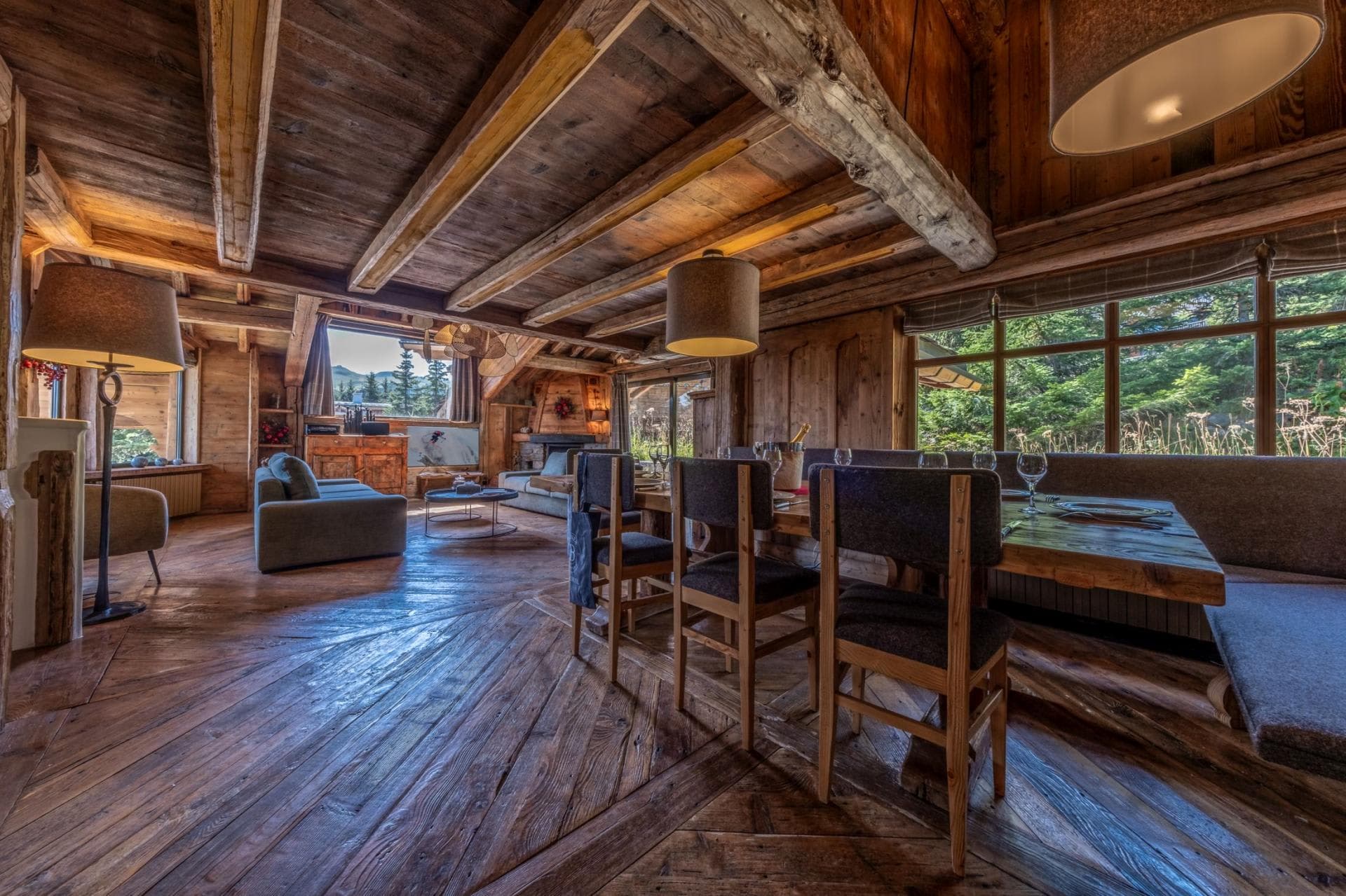Open-plan dining and living area with original reclaimed timber beams
