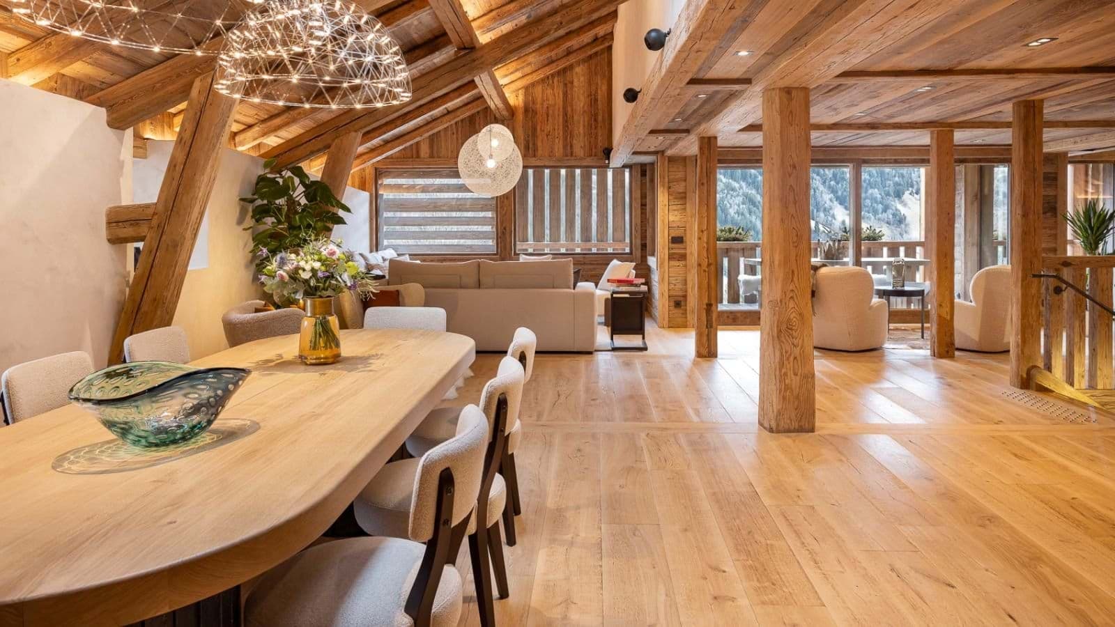 Open-plan dining and living area with seating for 8 and mountain views