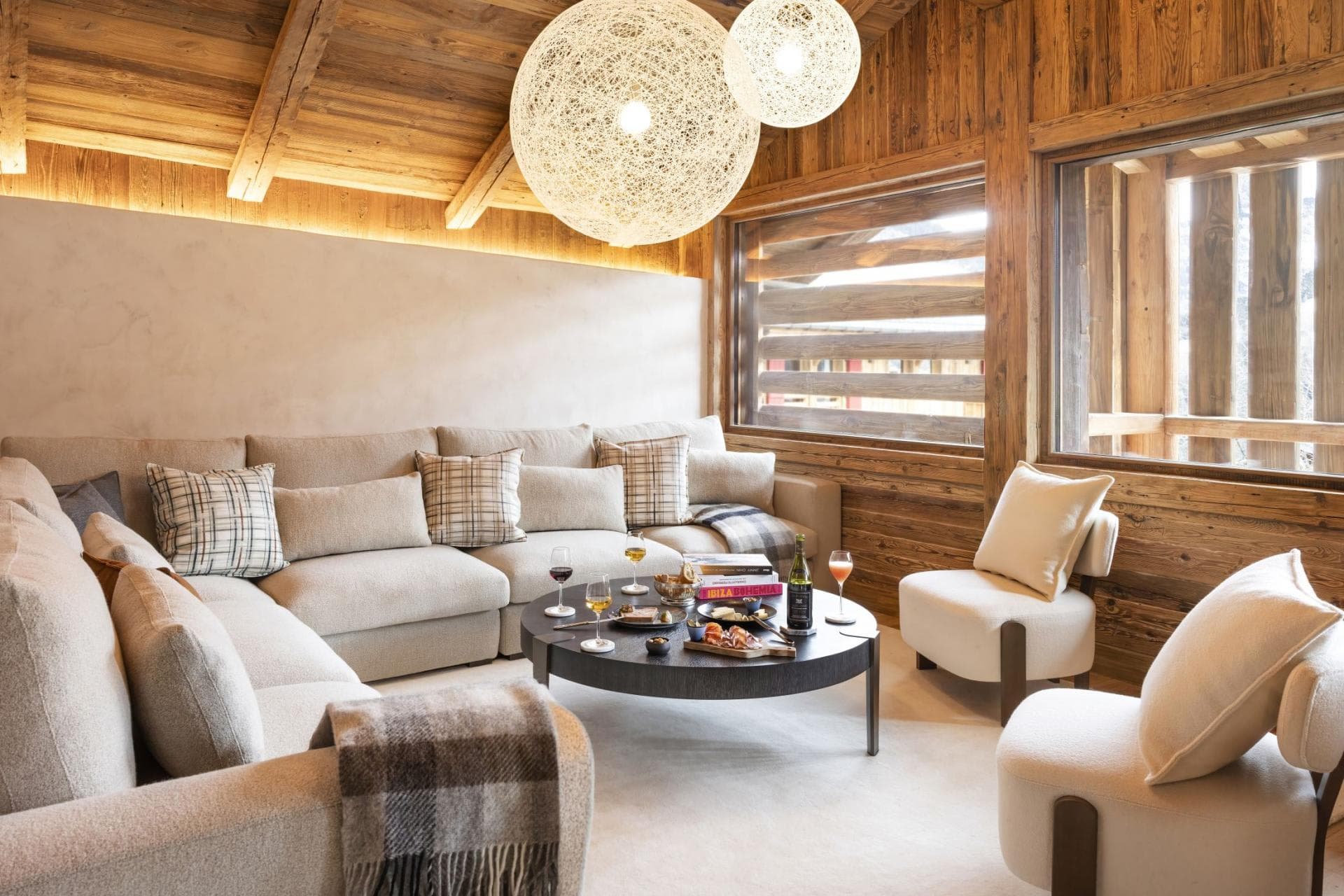 Living area with sectional seating for 8 and vaulted timber ceilings