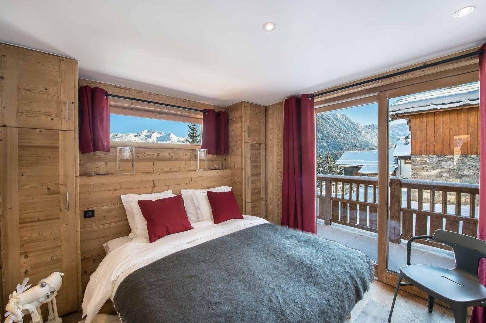 Double bedroom with television and terrace access