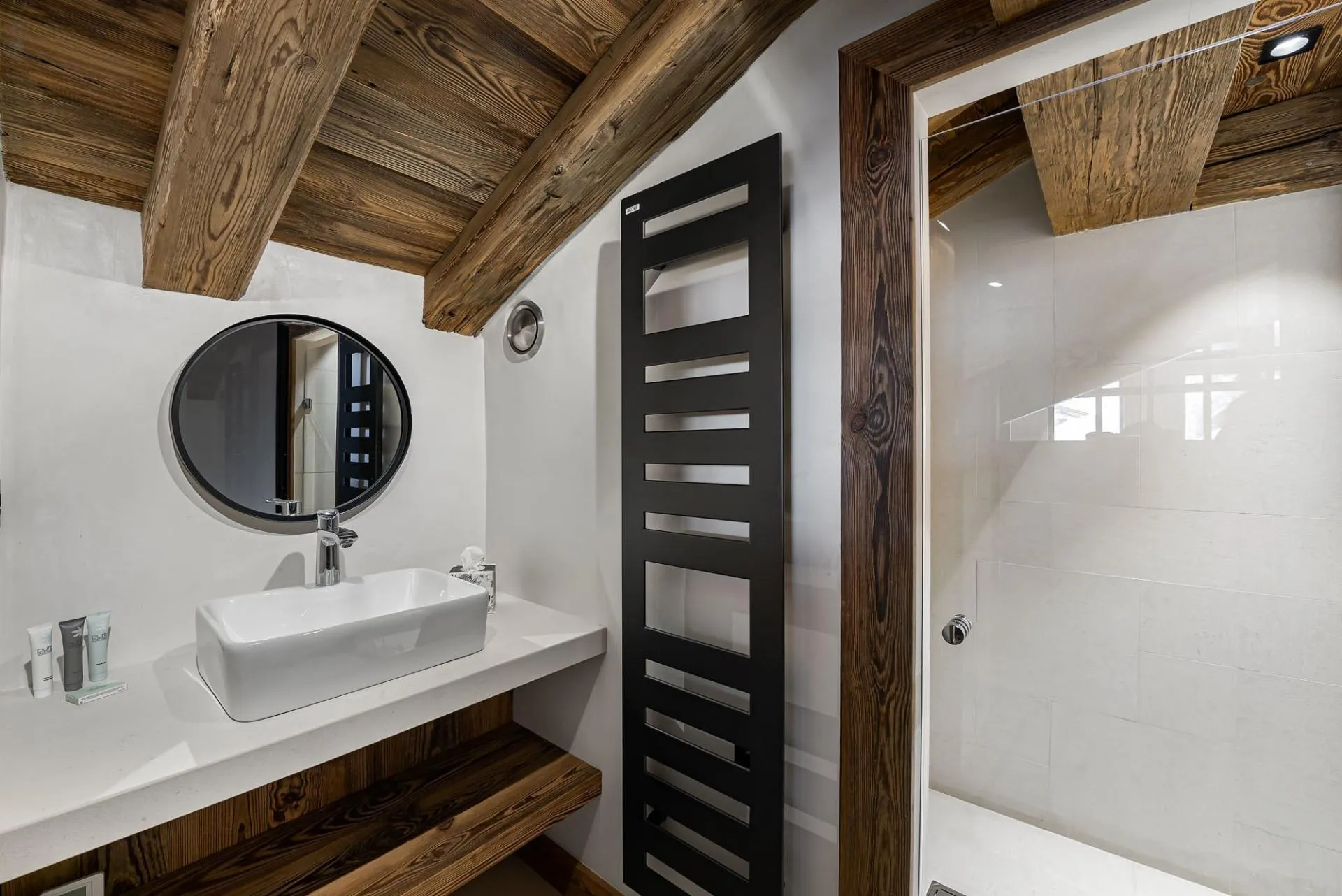 Bathroom with a walk-in shower and heated towel rail