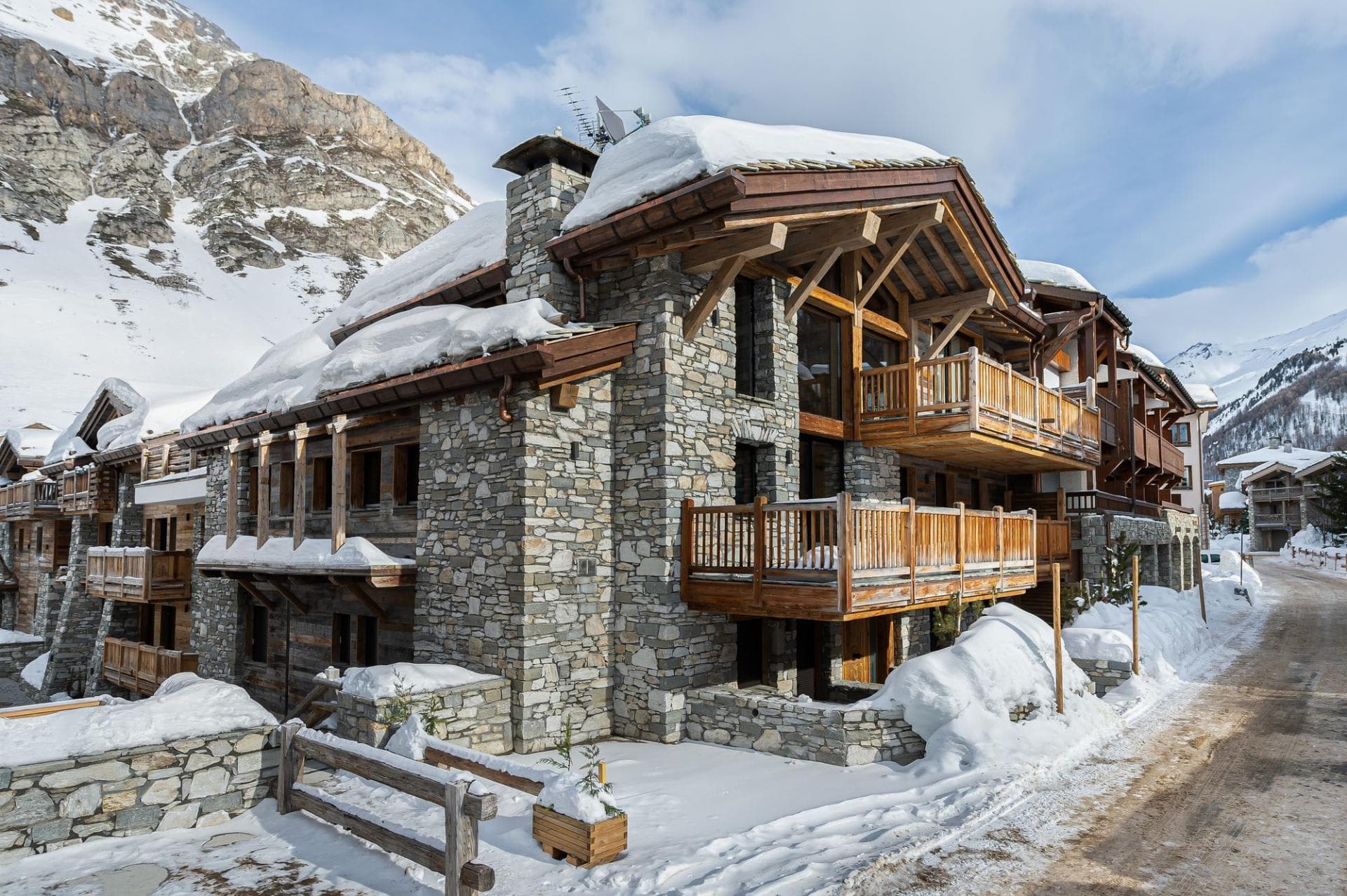 Stone and timber chalet with private balconies and mountain views