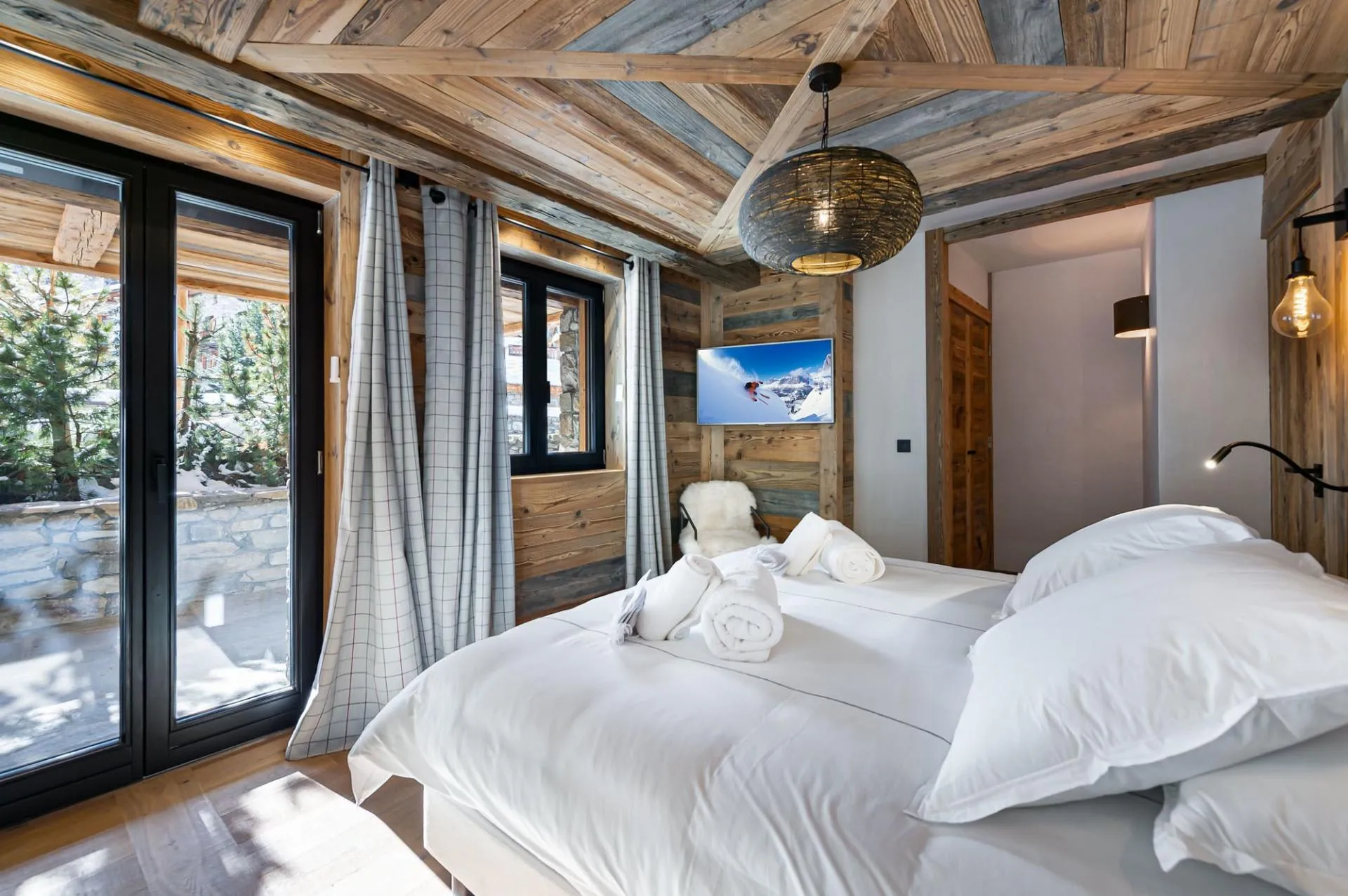 Double bedroom beside glazed doors