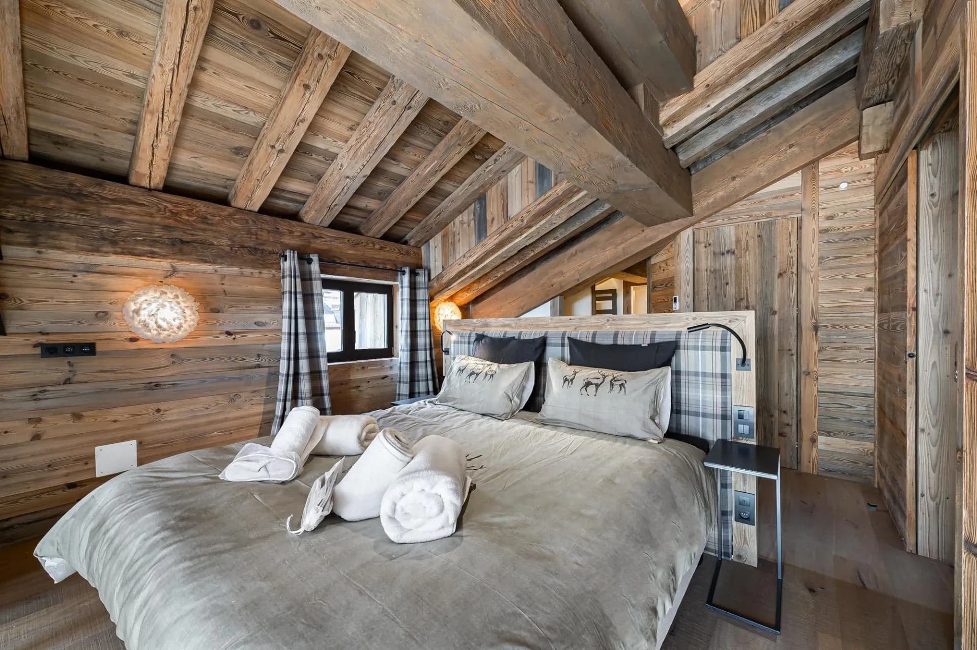 Double bedroom beneath exposed timber beams