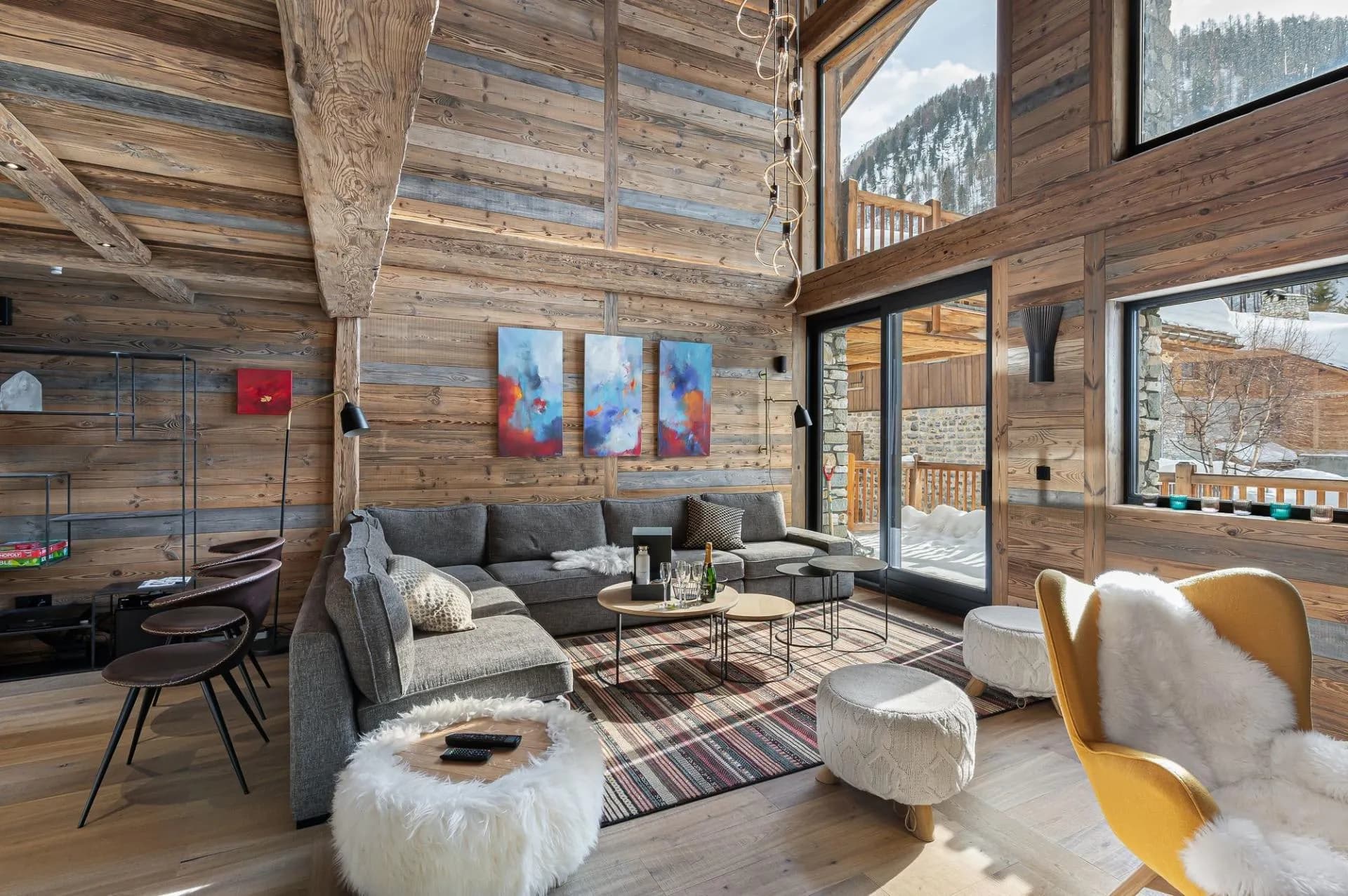 Timber-lined living area beside tall glazed doors
