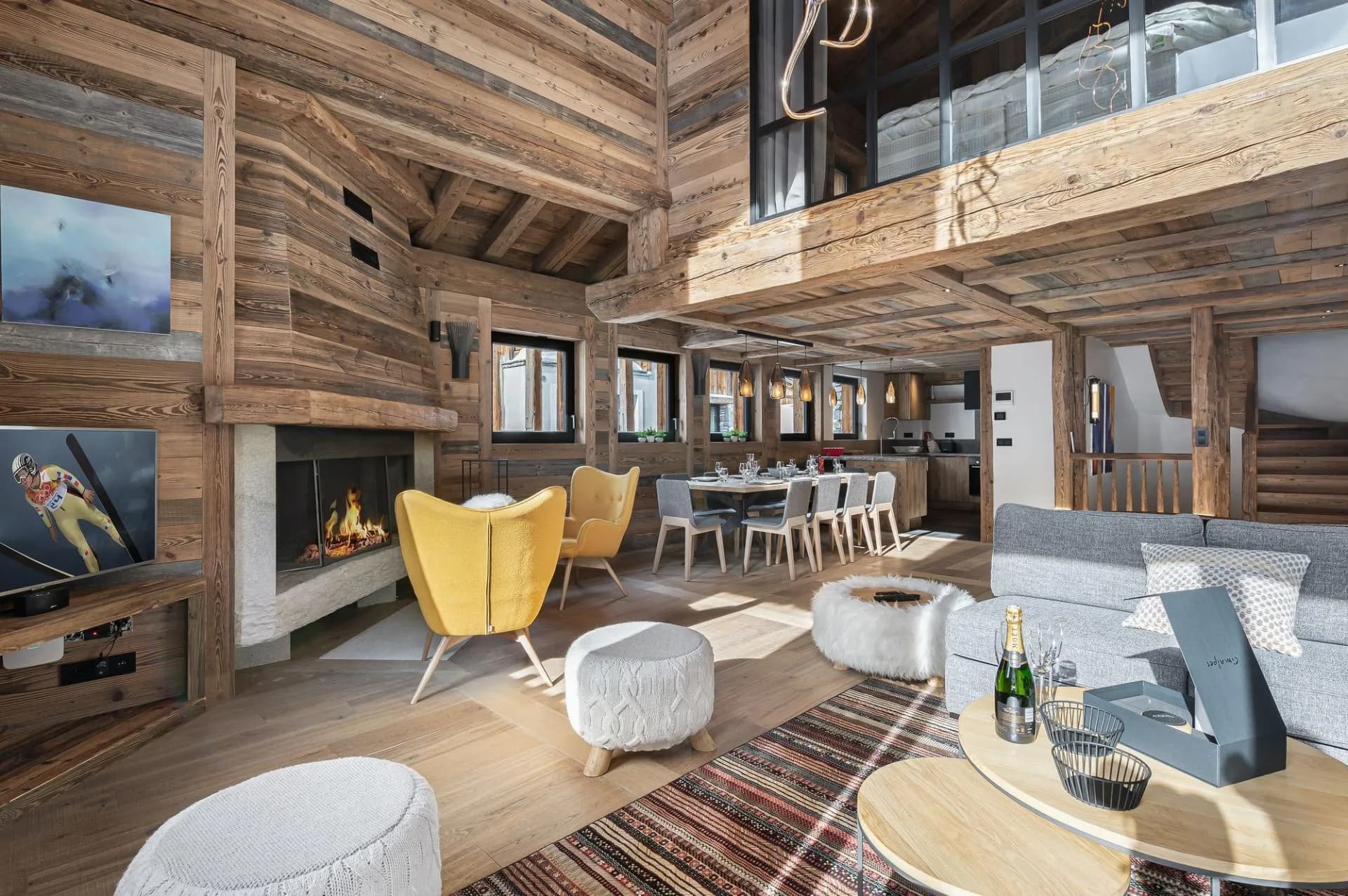 Open-plan living and dining room beneath a mezzanine