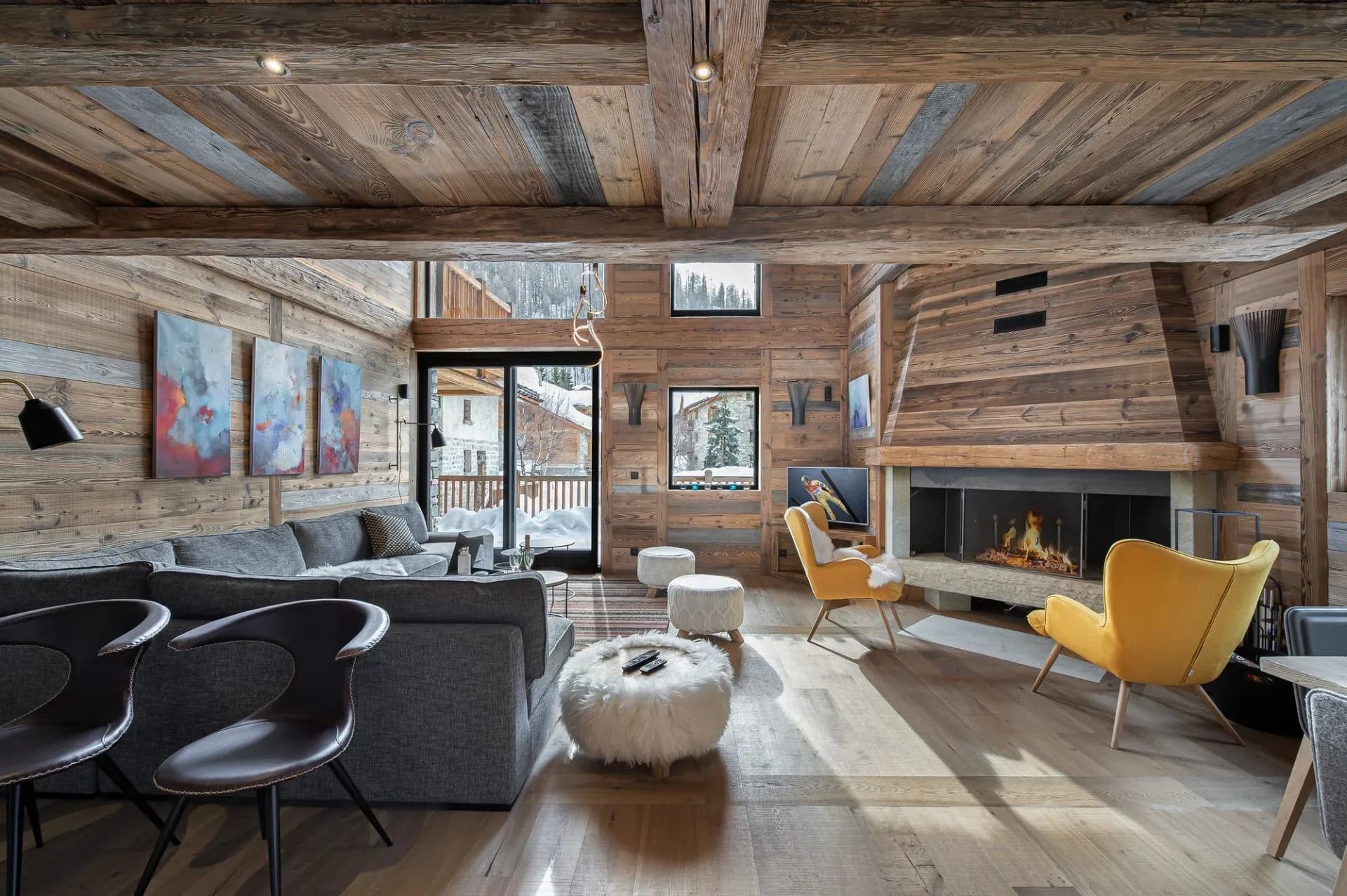 Living room with a wood fireplace and balcony doors