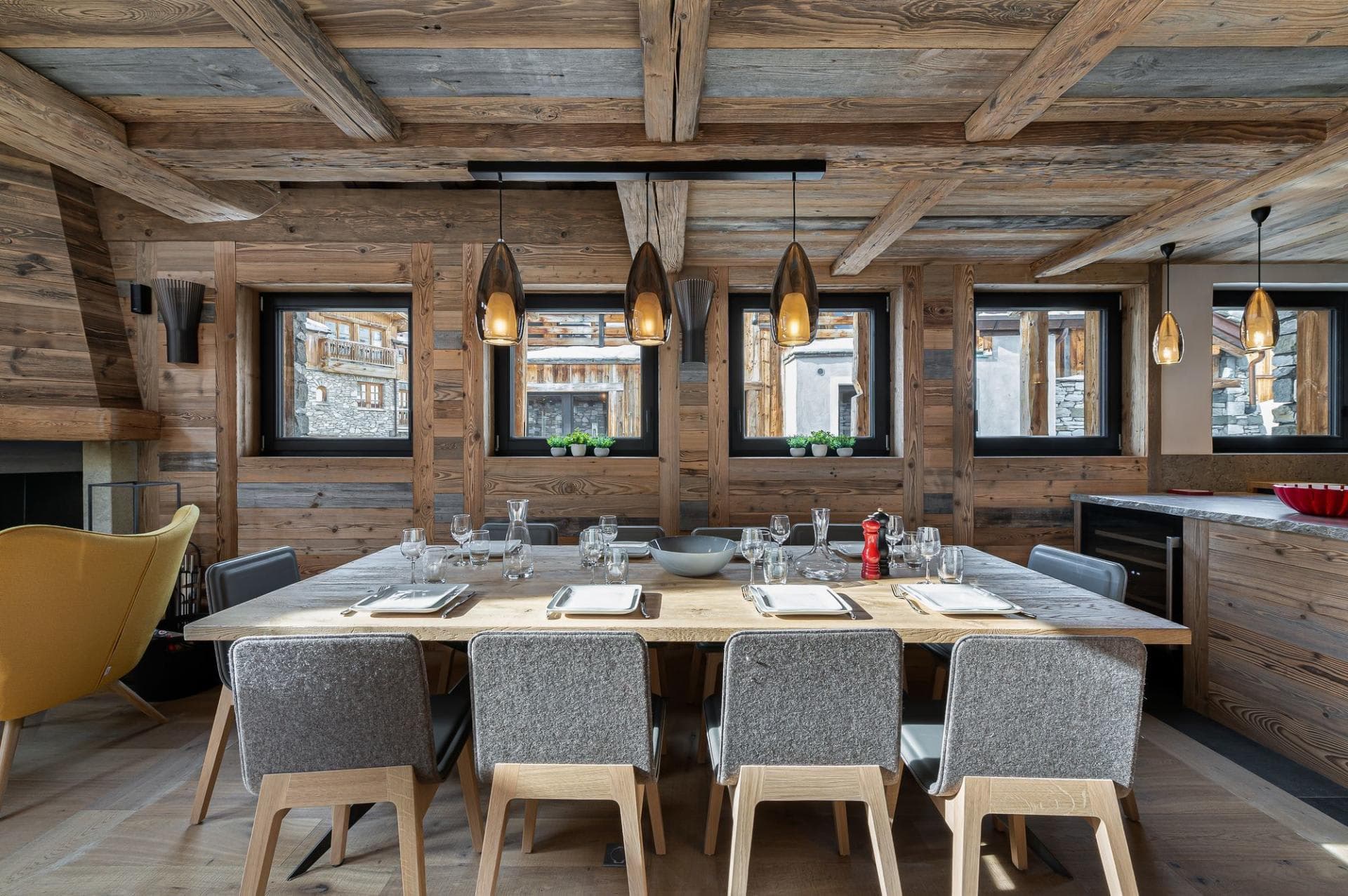 Dining area seats 10; features reclaimed wood finishes and adjacent fireplace
