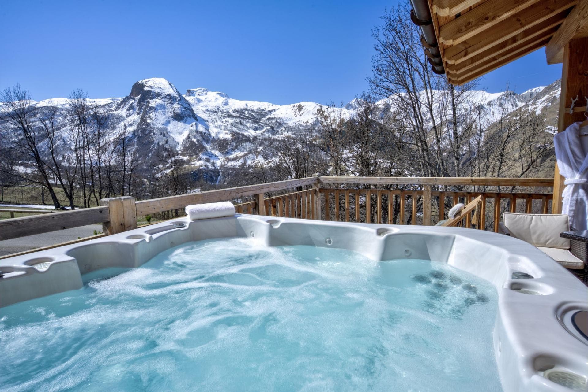 Outdoor hot tub seats 6; snow-capped mountain views