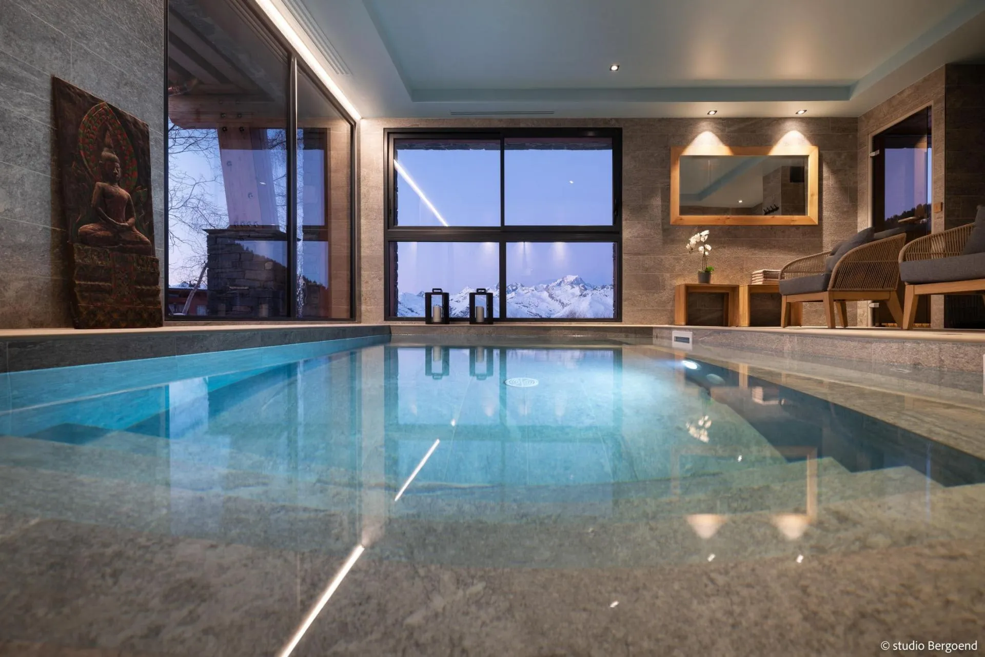 Indoor swimming pool with counter-current and mountain views