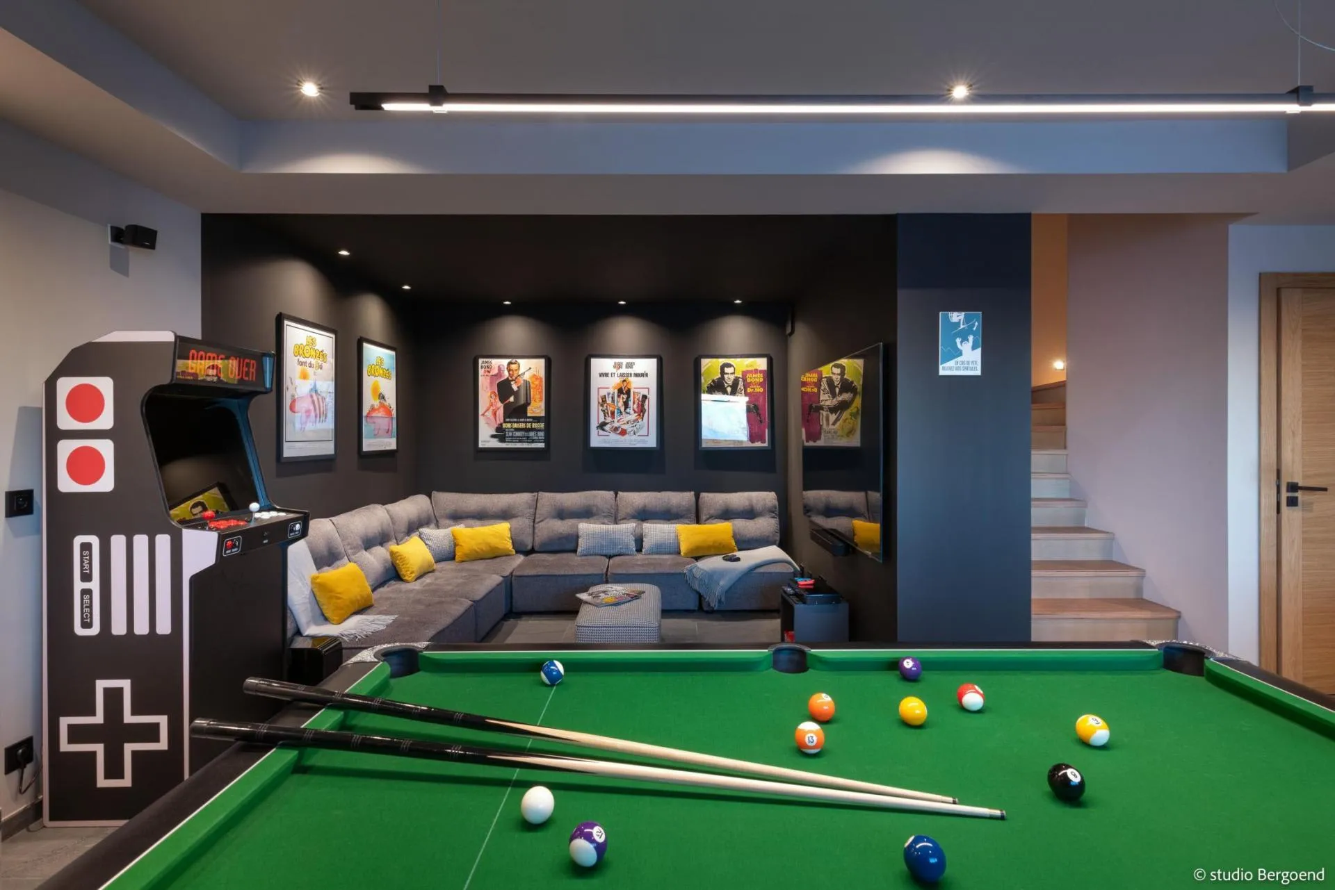 Games room with pool table, arcade cabinet and cinema seating