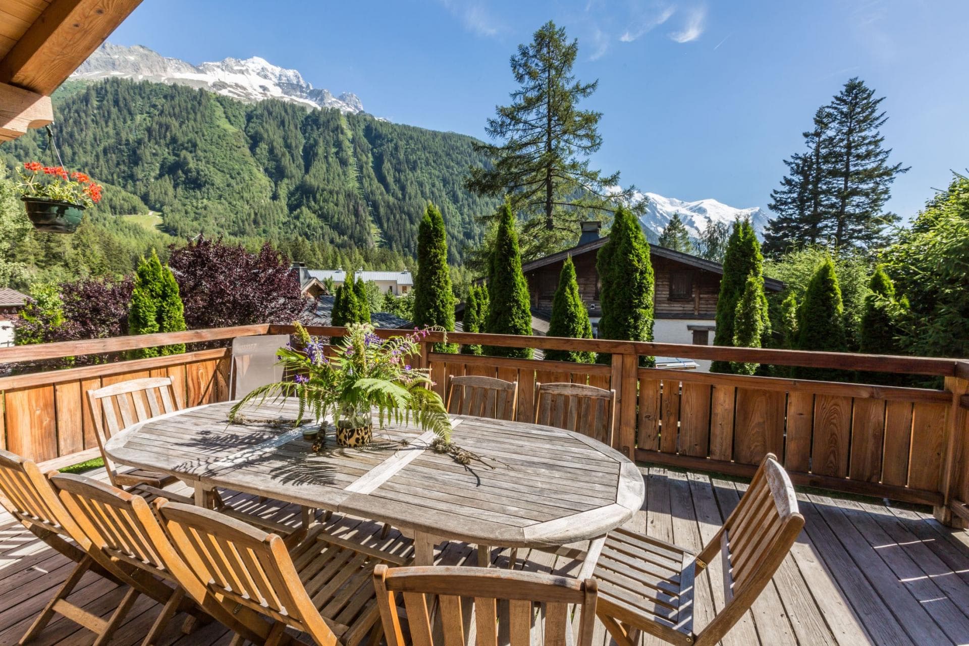 Wooden balcony with dining for 8 and views of Mont Blanc