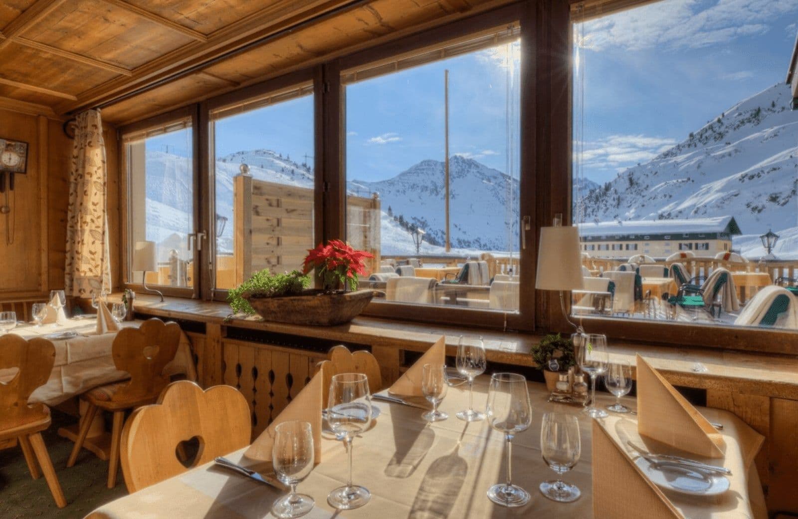 Dining area with panoramic mountain views; window seating for four