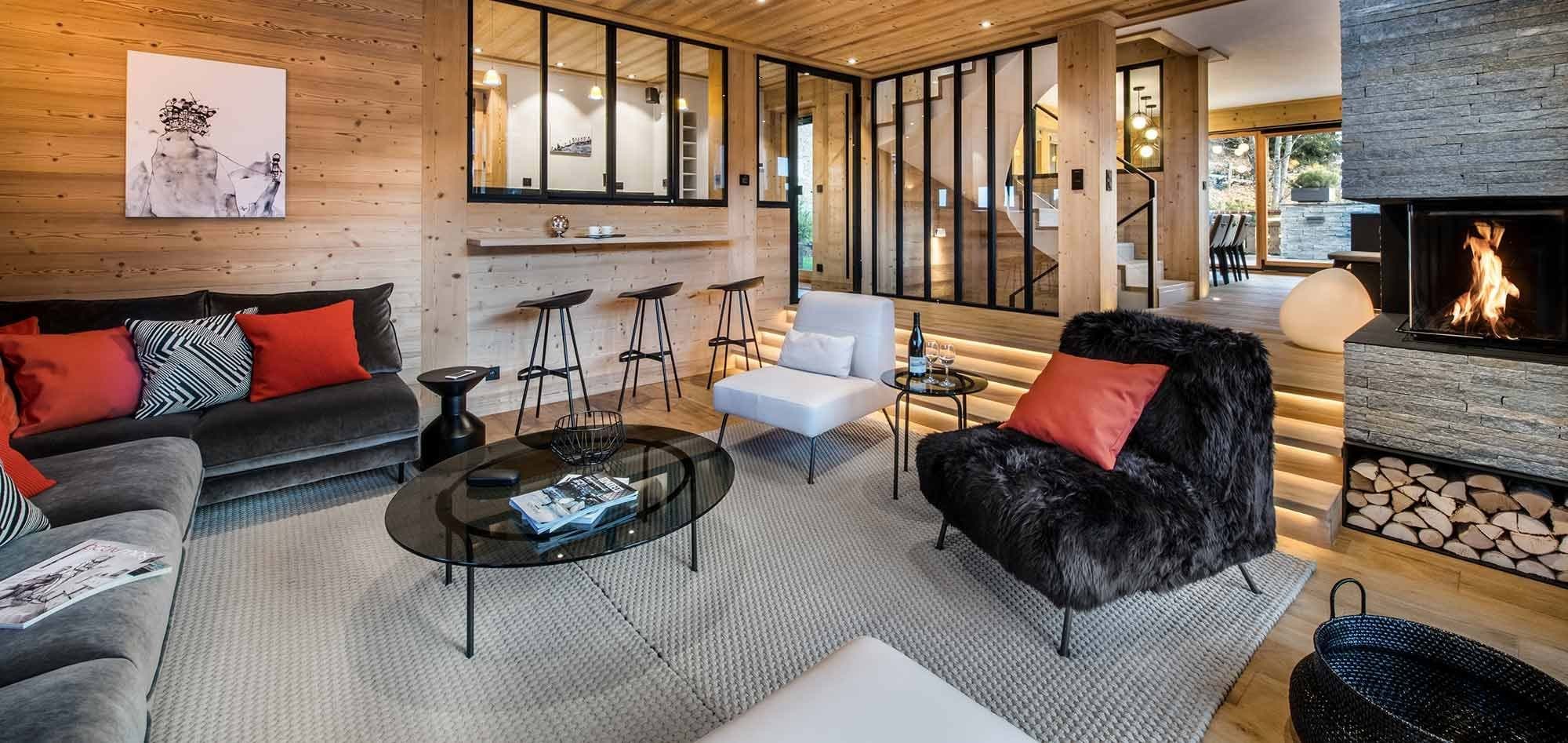 Living area with wood-burning fireplace and bar seating for three