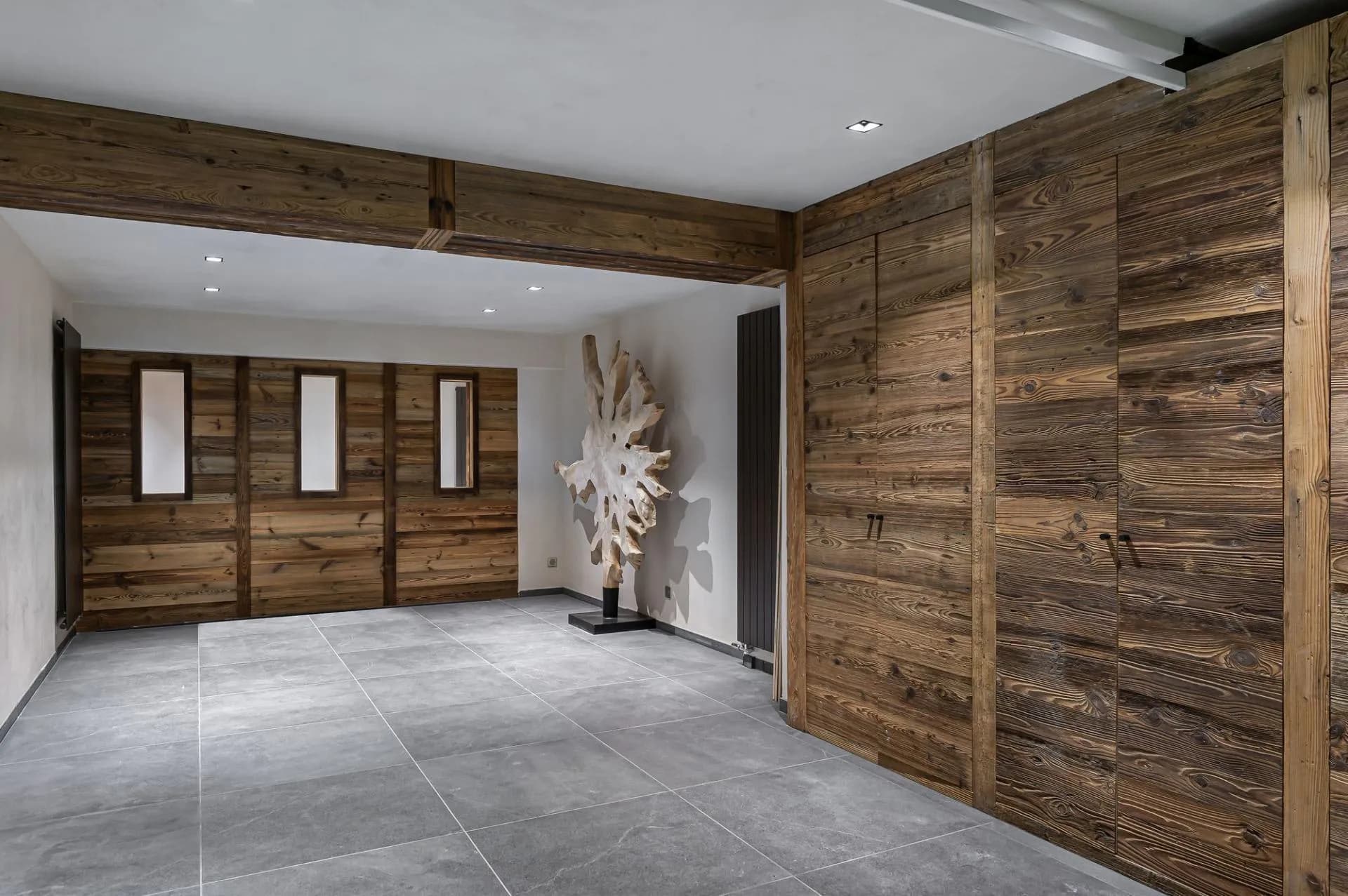 Entrance lobby with timber storage and stone flooring