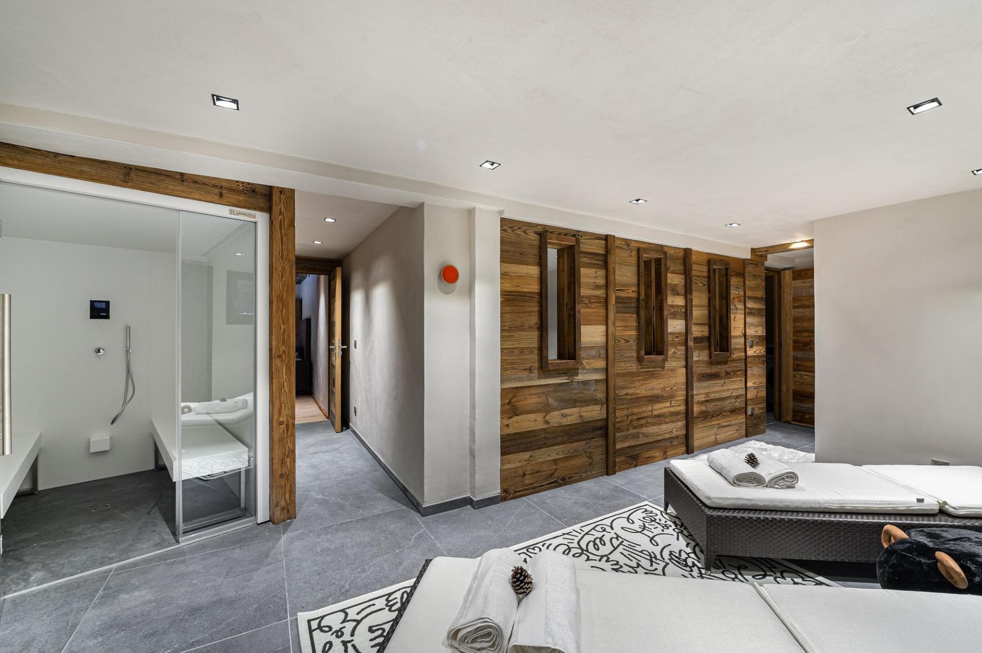 Wellness area with private steam room and relaxation loungers