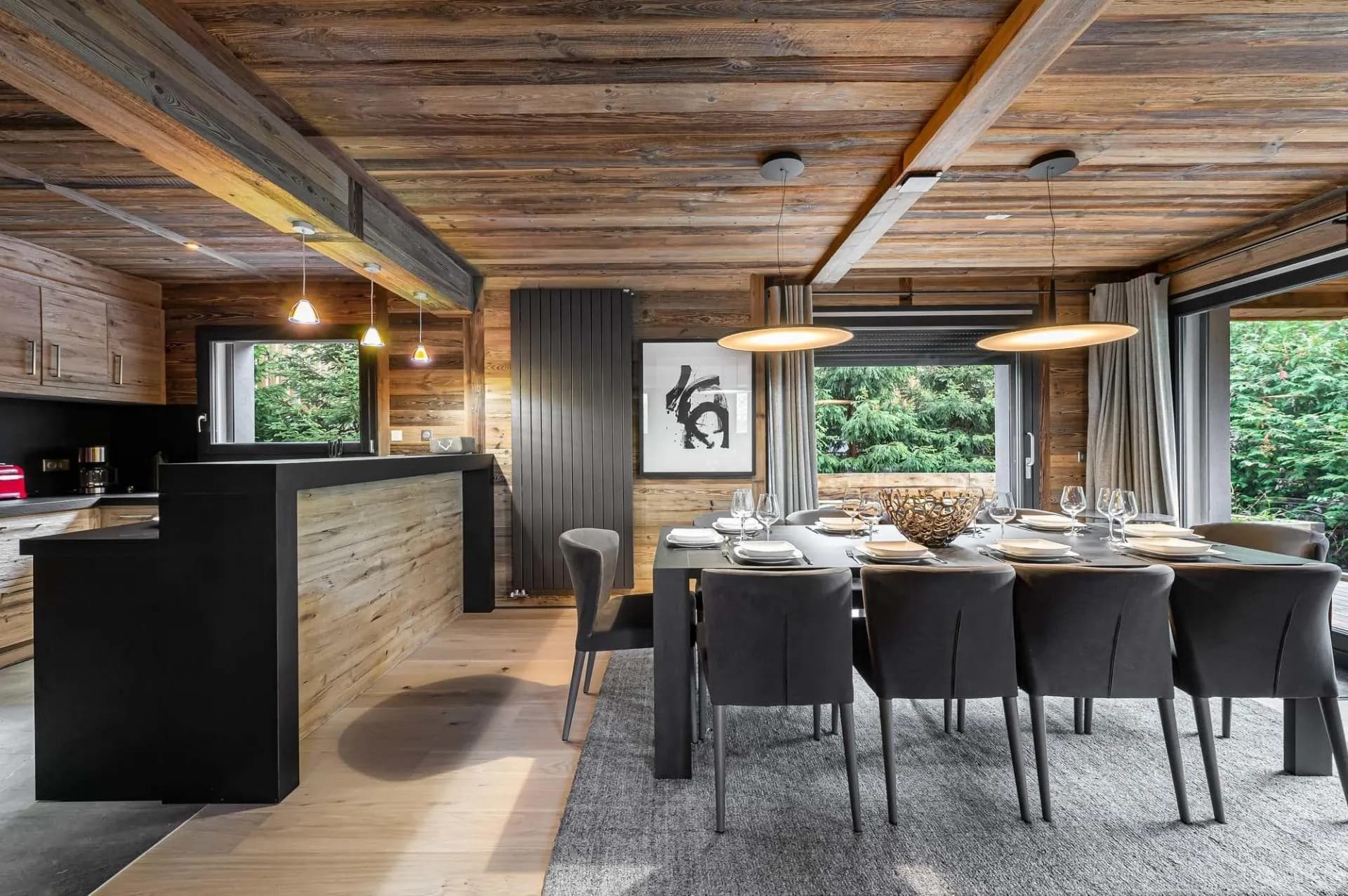 Dining table beside the open kitchen and breakfast bar
