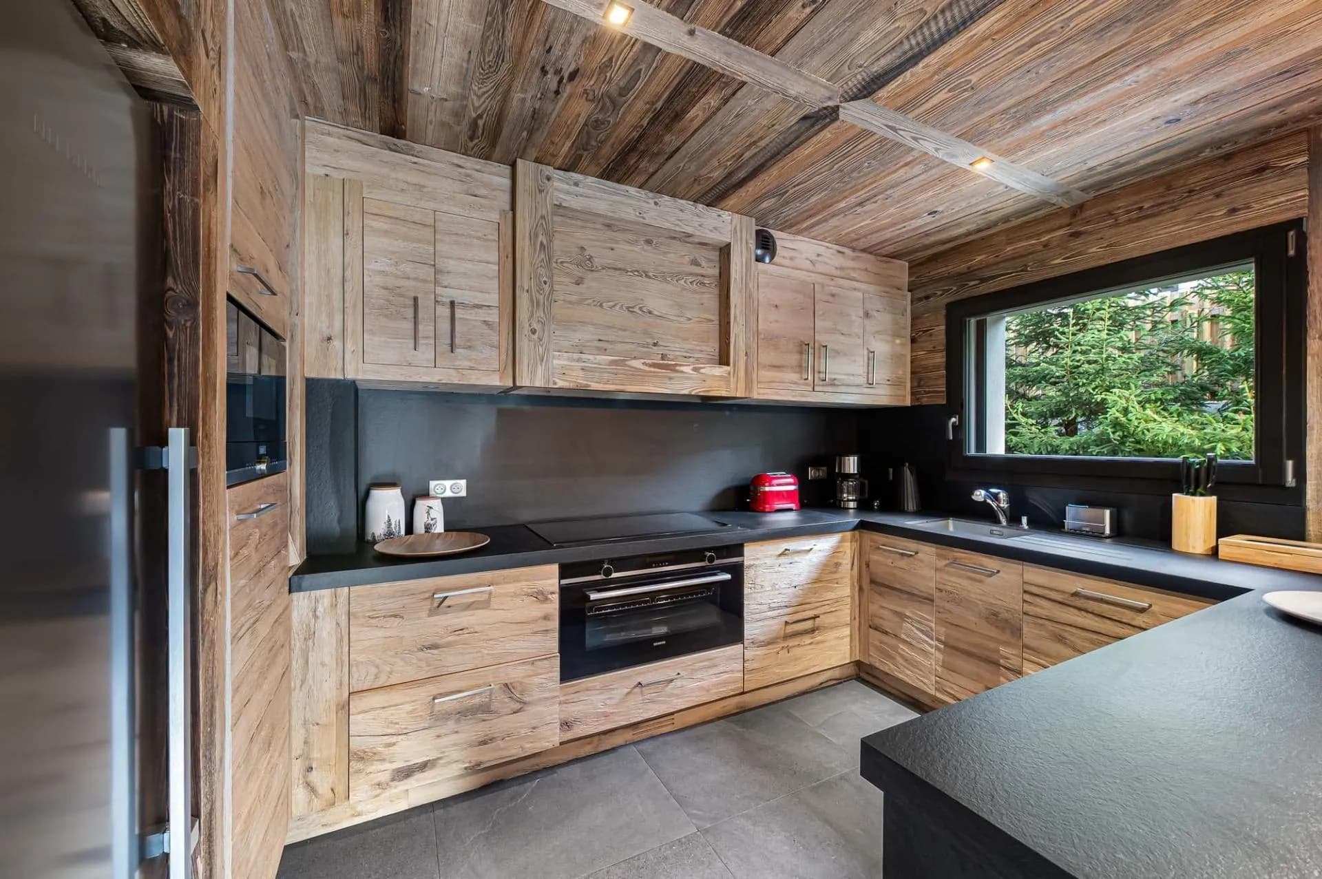 Fitted kitchen with timber cabinetry and induction hob