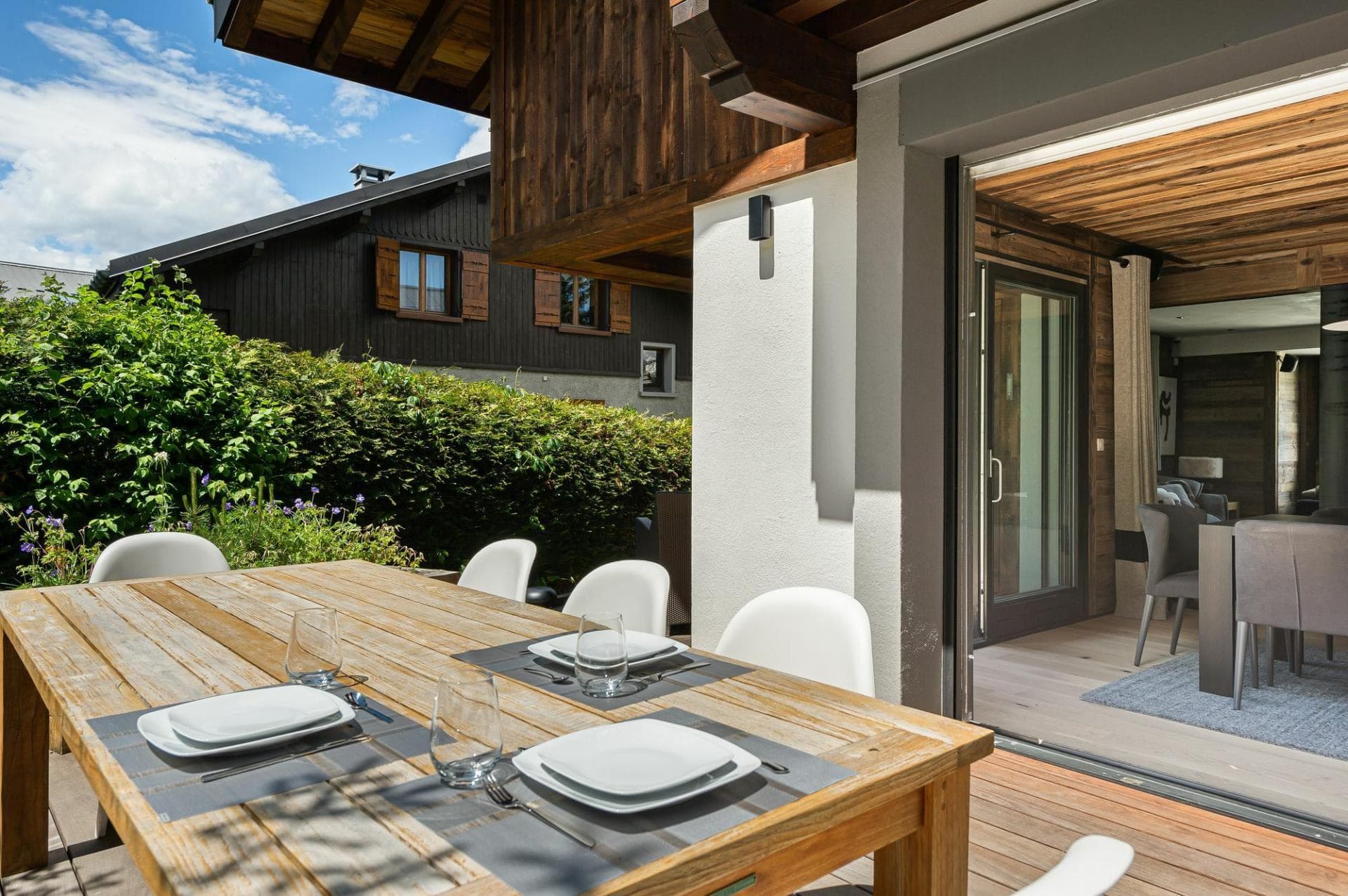 Outdoor dining table seats 6 on covered private deck