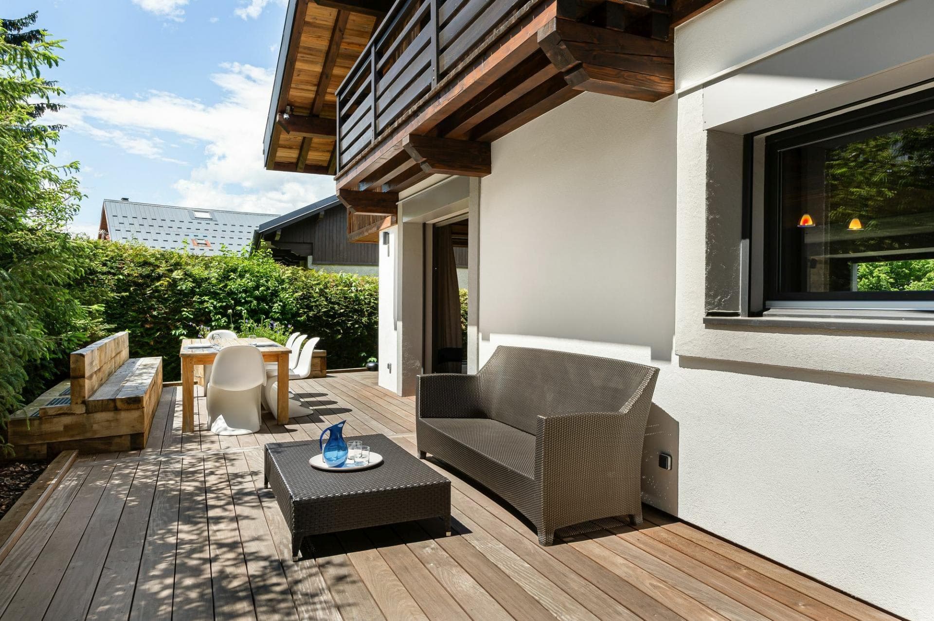 Private deck with wicker lounge and dining table seats 6