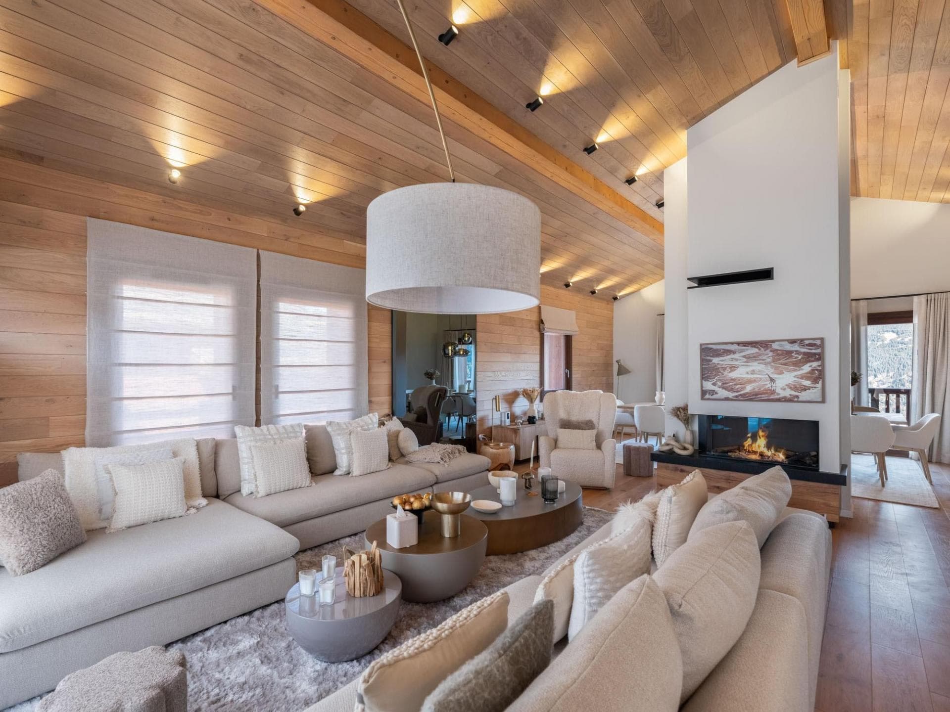 Living room with wood-clad ceiling and built-in fireplace