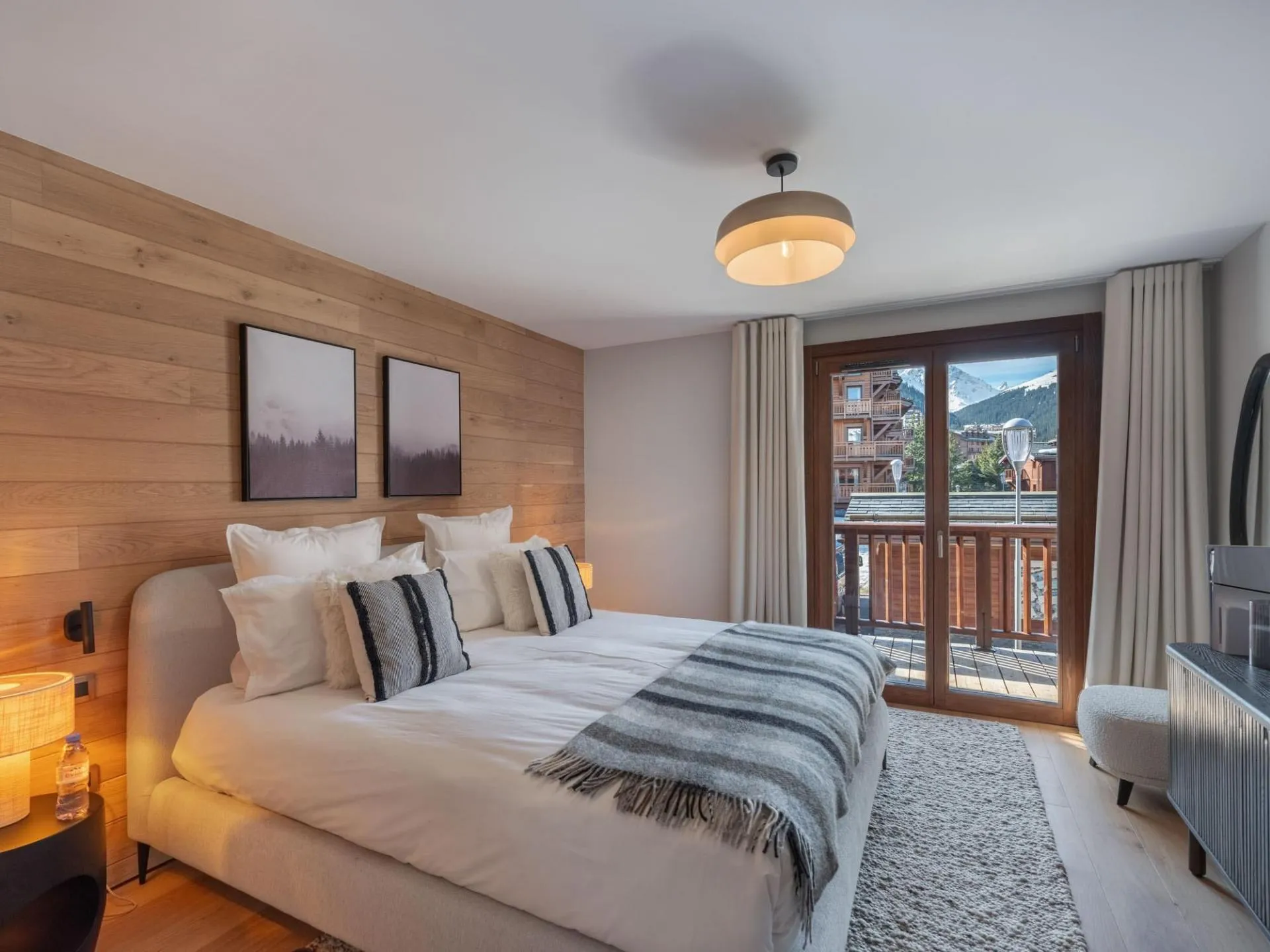 Double bedroom with balcony doors and mountain views