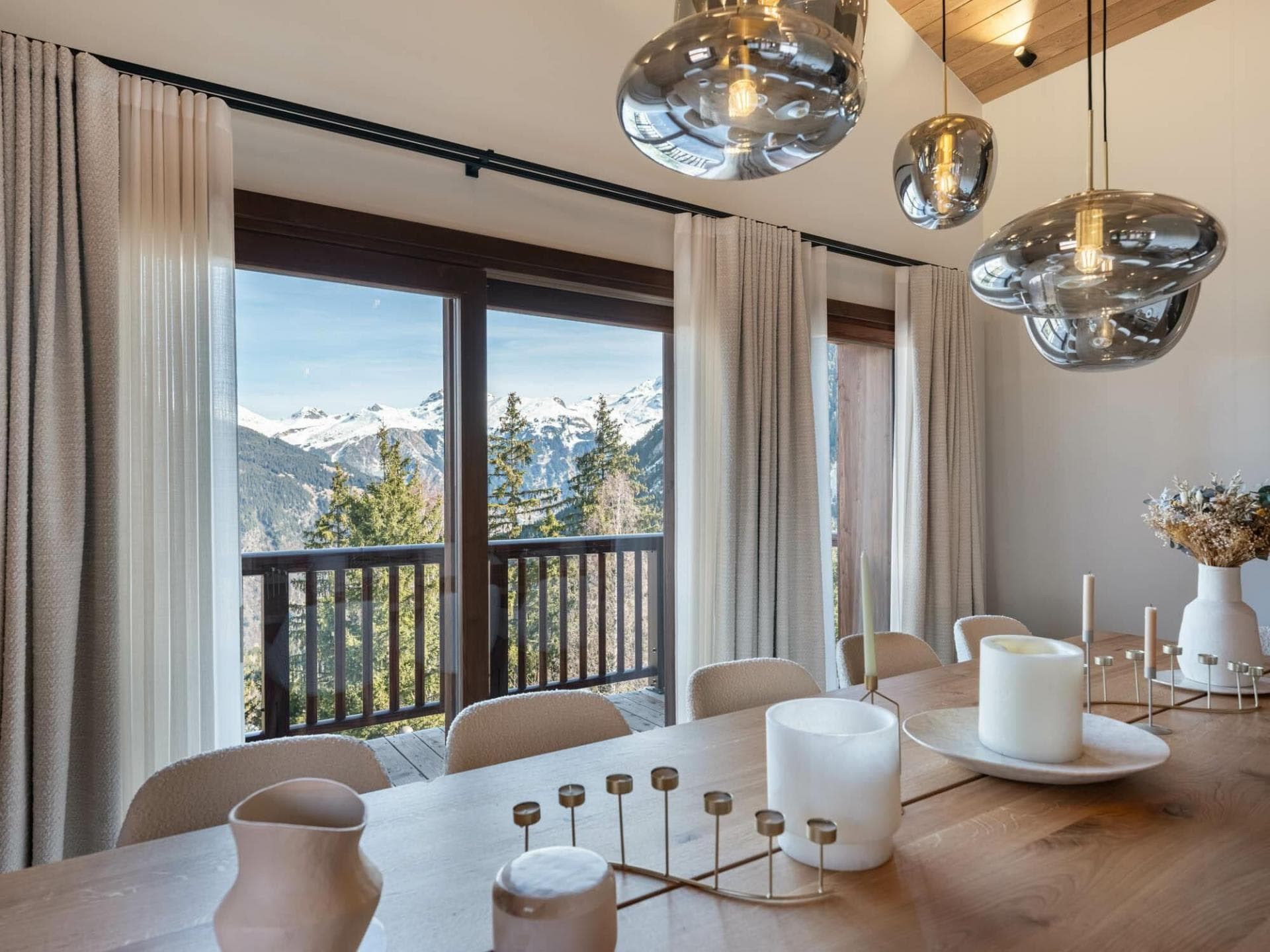 Dining area with mountain views and direct balcony access
