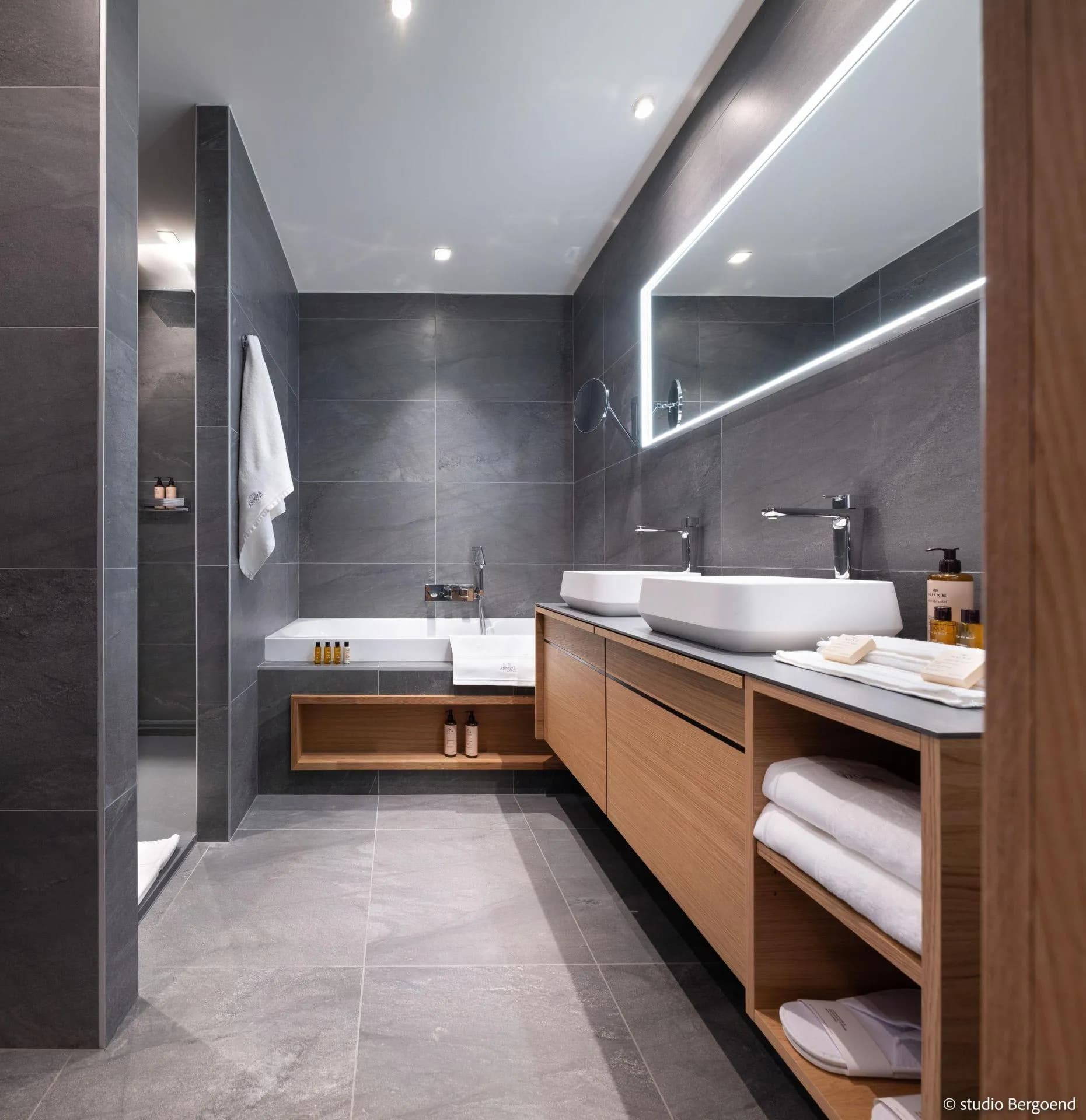 Bathroom with twin basins, bathtub and walk-in shower