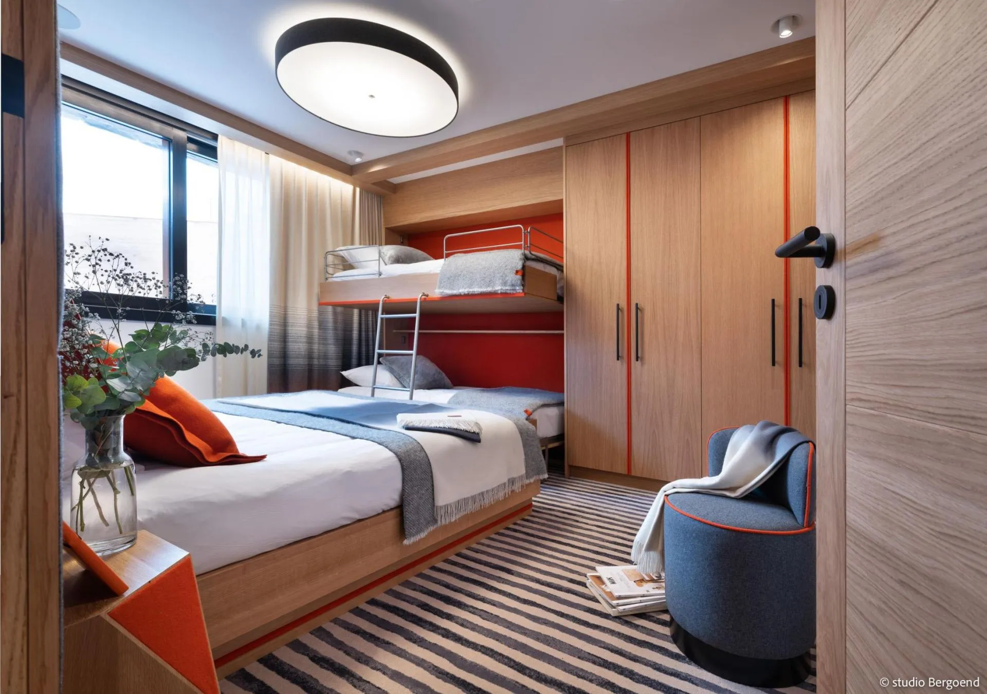 Family bedroom with double bed, bunk bed and built-in wardrobe