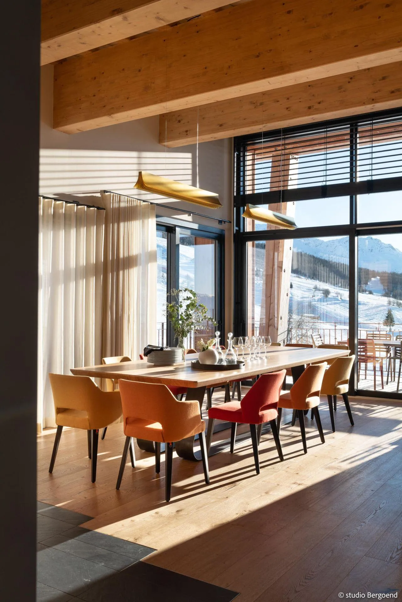 Dining area with floor-to-ceiling mountain views