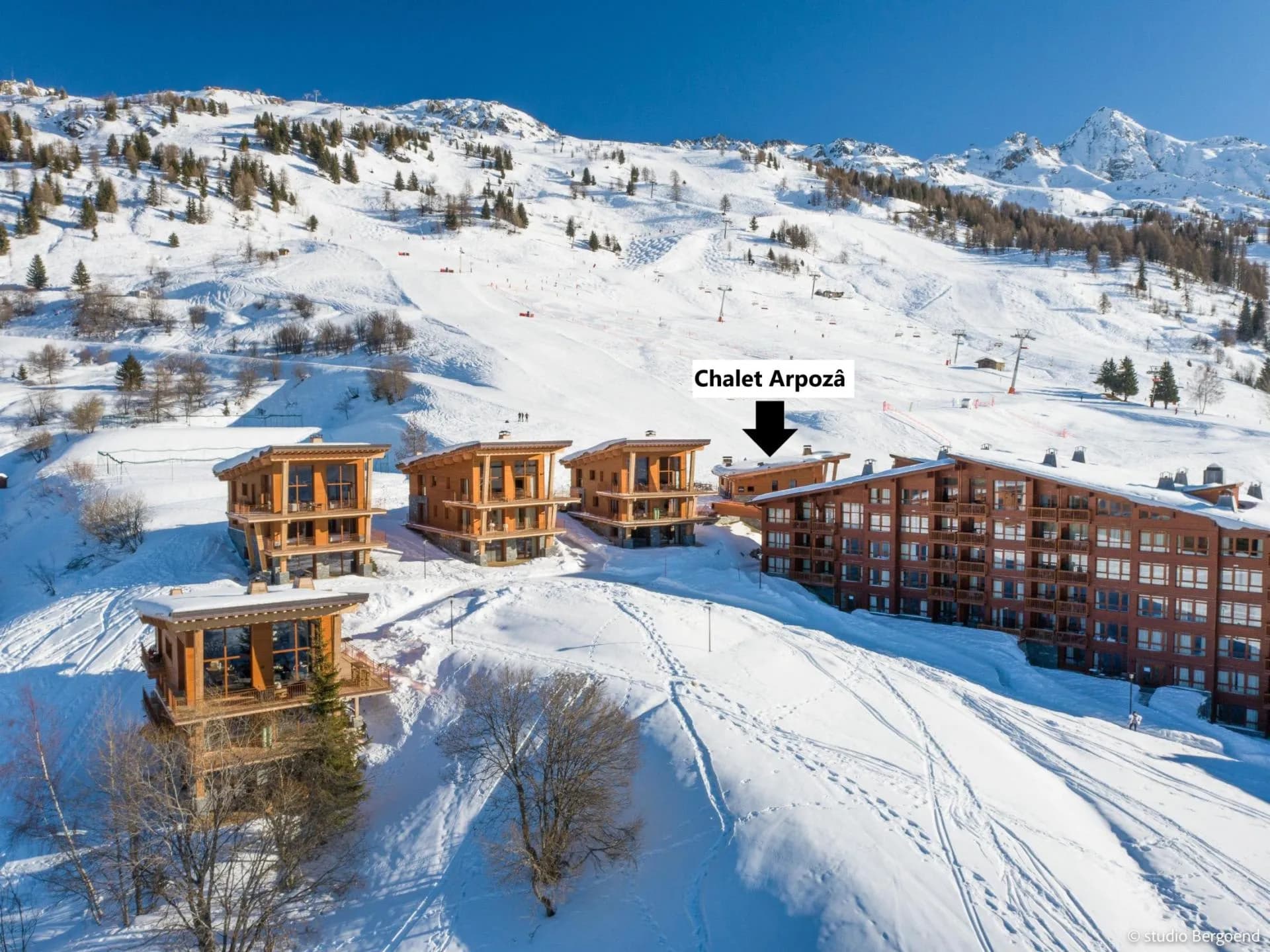 Chalet beside groomed ski slopes