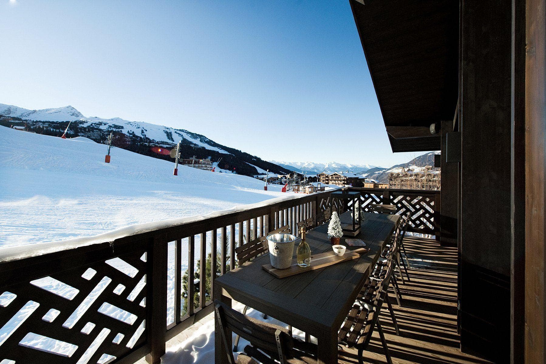 Covered balcony with dining table for 8 and ski-in/ski-out access