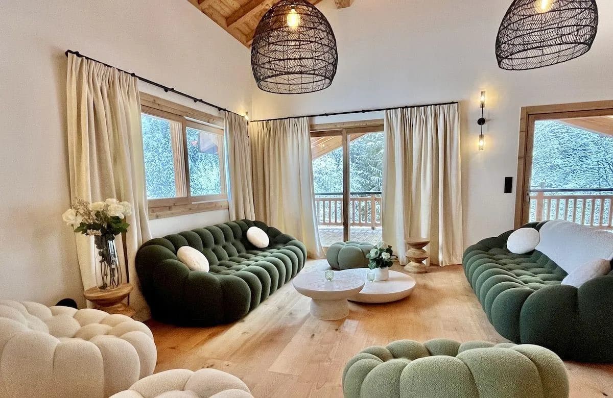 Open-plan living area with contemporary seating and balcony access