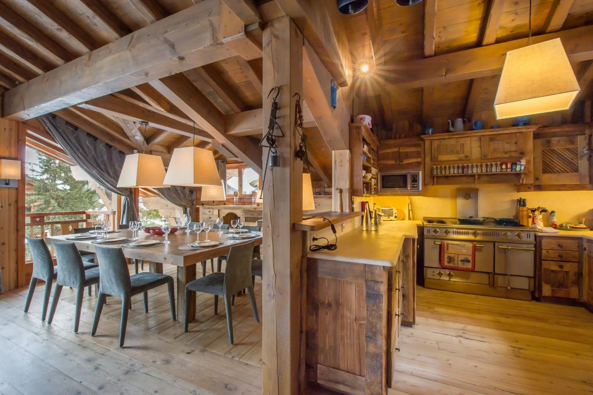 Dining area beside the open kitchen and balcony