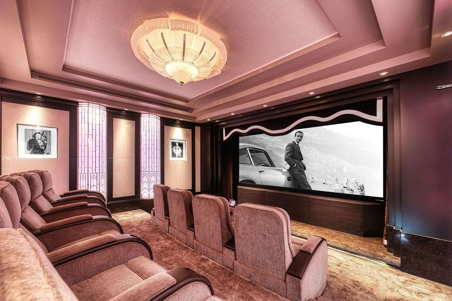 Private theater with tiered recliner seating for 8 and Art Deco styling
