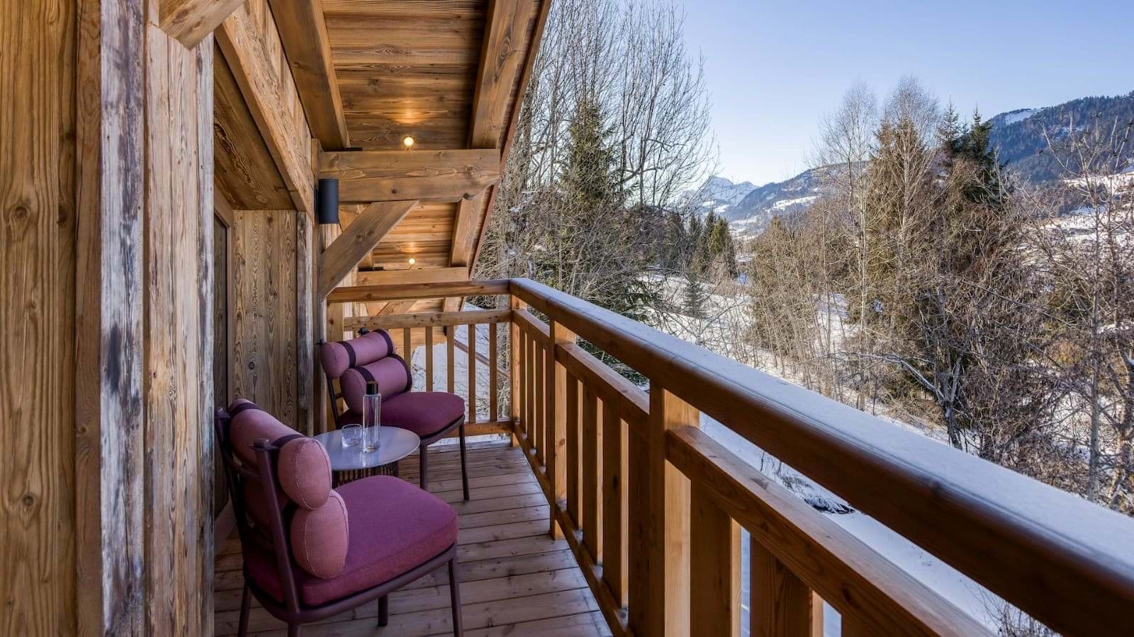 Covered balcony with seating for two and valley views