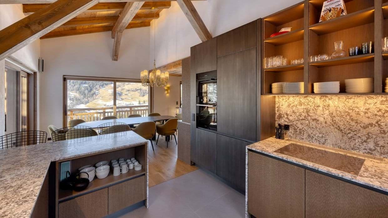 Kitchen with induction cooktop and dining area seating 10 with mountain views