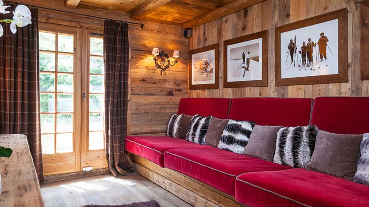 Media room with built-in banquette seating and terrace access