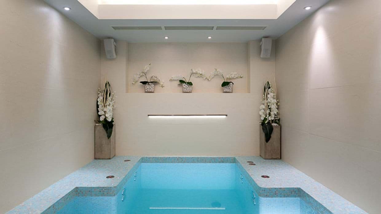 Indoor plunge pool with integrated surround sound and skylight