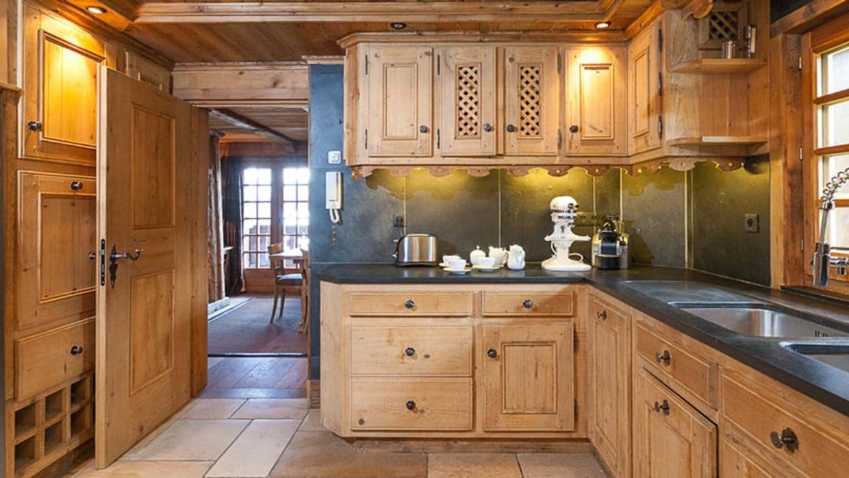 Kitchen with carved wood cabinetry, Nespresso machine, and stand mixer