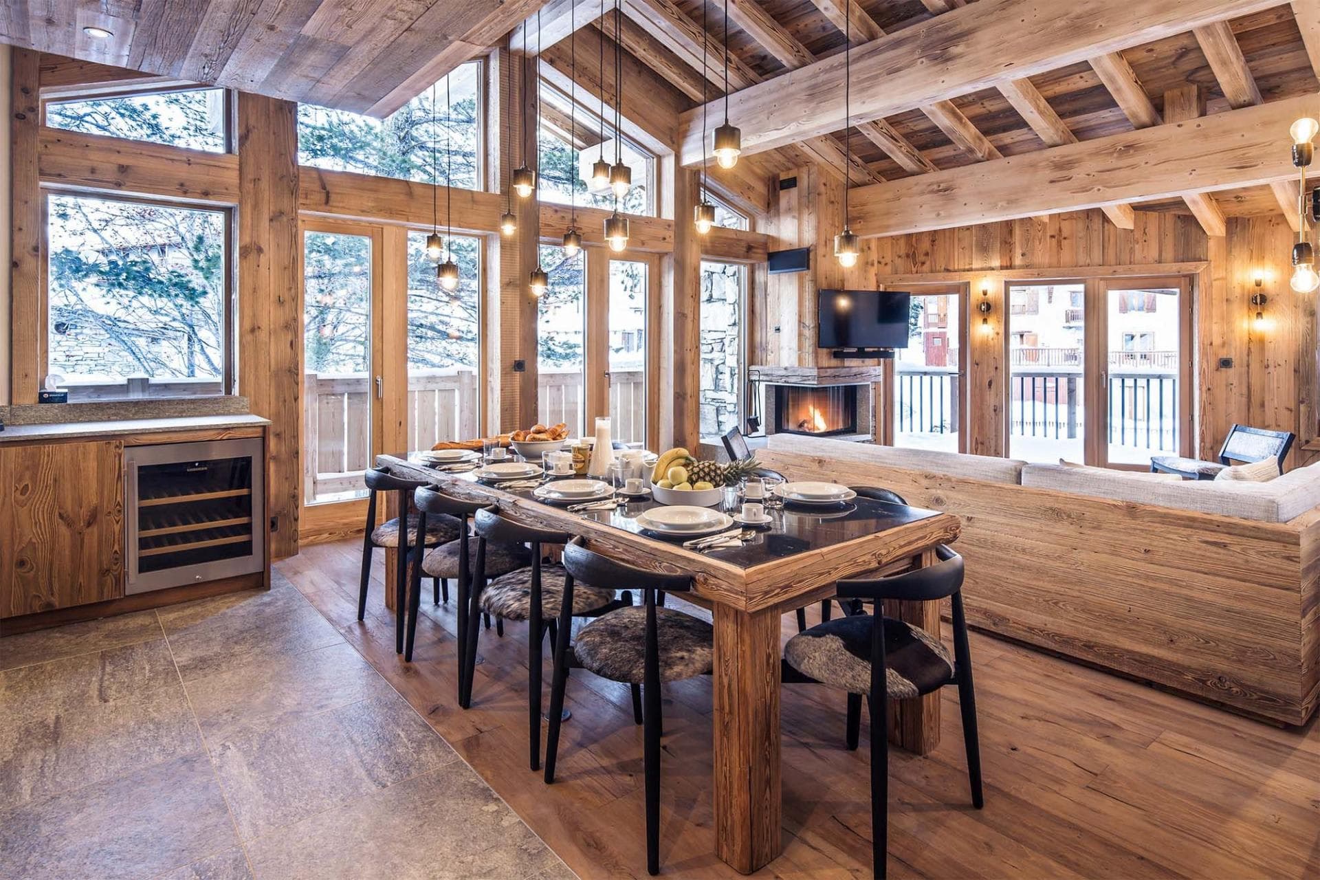 Dining area for 8 with wine fridge and wood-burning fireplace